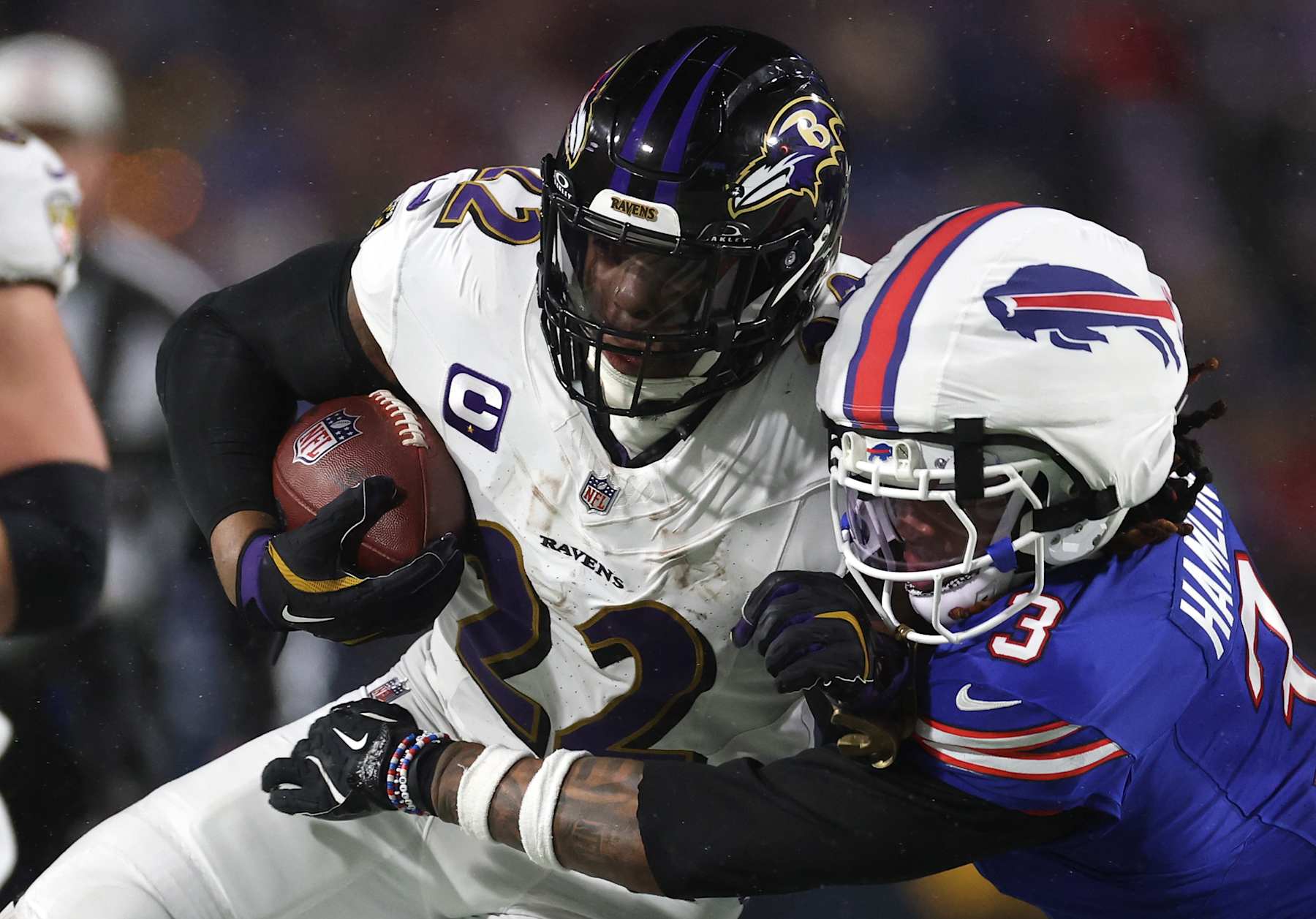 ORCHARD PARK, NEW YORK - JANUARY 19: Derrick Henry #22 of the Baltimore Ravens runs the ball against Damar Hamlin #3 of the Buffalo Bills during the third quarter during the AFC Divisional Playoff at Highmark Stadium on January 19, 2025 in Orchard Park, New York.  (Photo by Al Bello/Getty Images)