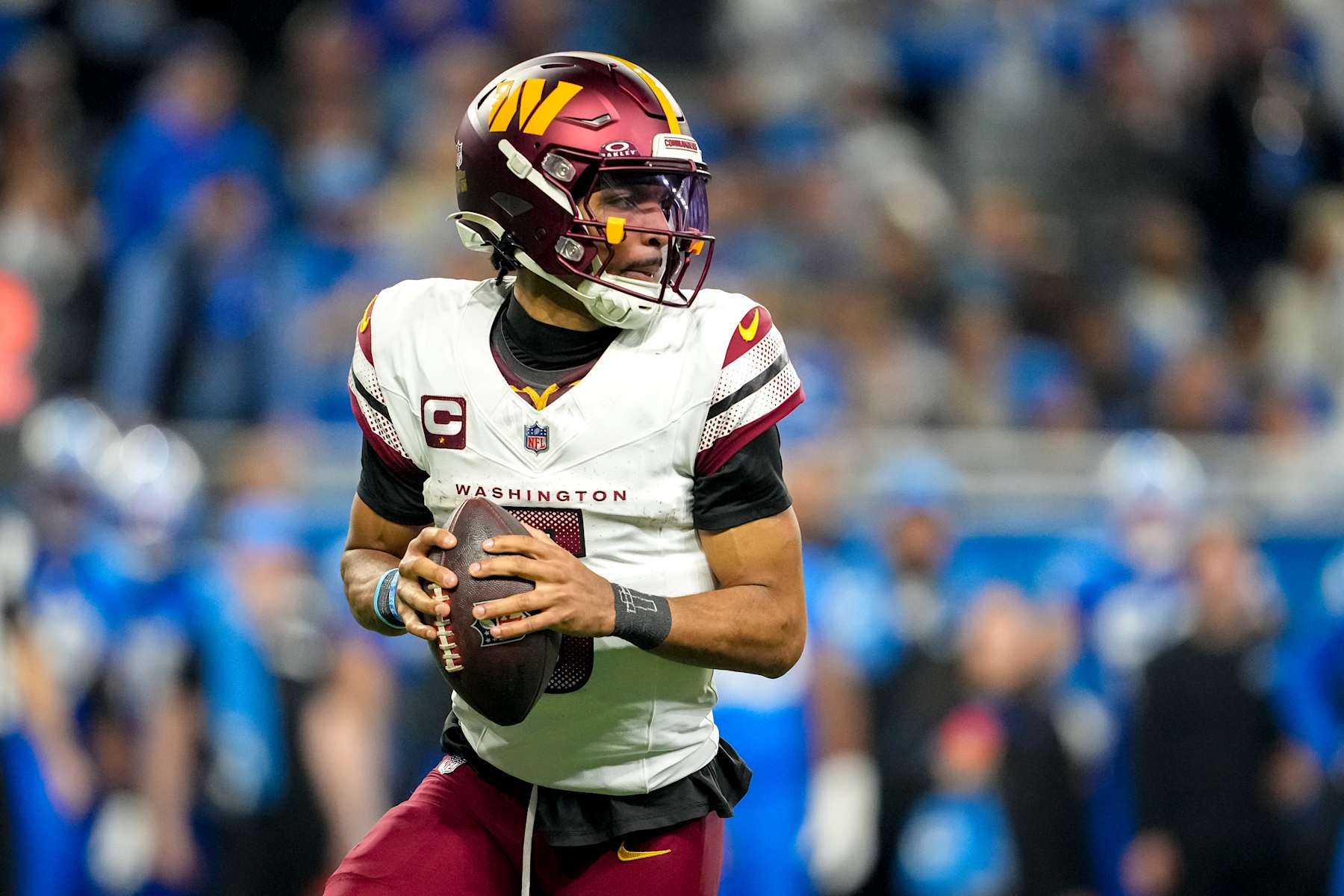 DETROIT, MICHIGAN - JANUARY 18: Jayden Daniels #5 of the Washington Commanders looks to throw the ball during the third quarter against the Detroit Lions in the NFC Divisional Playoff at Ford Field on January 18, 2025 in Detroit, Michigan.  (Photo by Nic Antaya/Getty Images)
