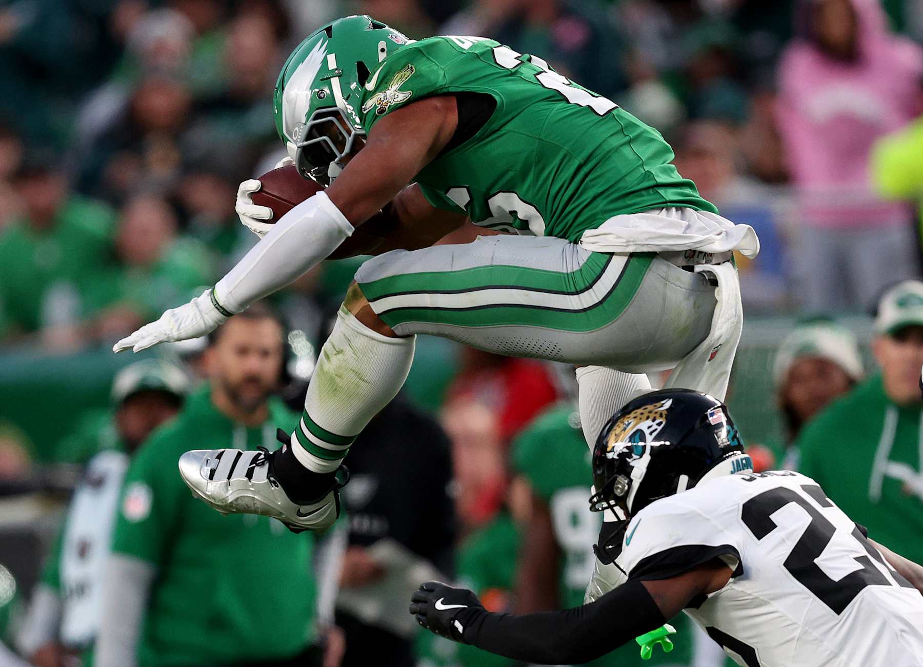 PHILADELPHIA, PENNSYLVANIA - NOVEMBER 03: Saquon Barkley #26 of the Philadelphia Eagles reverse hurdles over Jarrian Jones #22 of the Jacksonville Jaguars in the second quarter at Lincoln Financial Field on November 03, 2024 in Philadelphia, Pennsylvania. (Photo by Elsa/Getty Images)