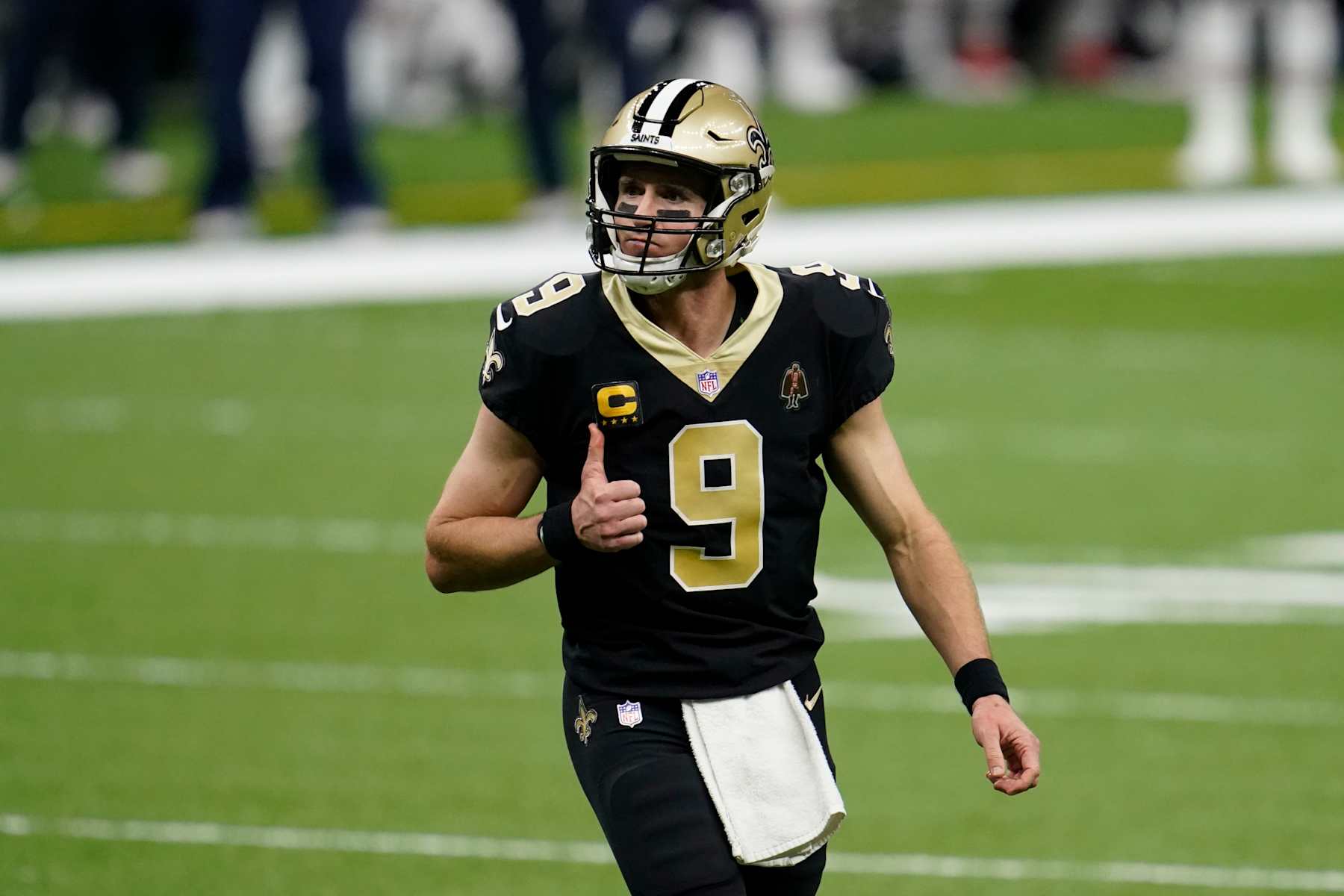 NEW ORLEANS, LOUISIANA - JANUARY 10: Drew Brees #9 of the New Orleans Saints gives a thumbs up during an NFL wild-card playoff football game against the Chicago Bears on January 10, 2021 in New Orleans, Louisiana. (Photo by Cooper Neill/Getty Images)