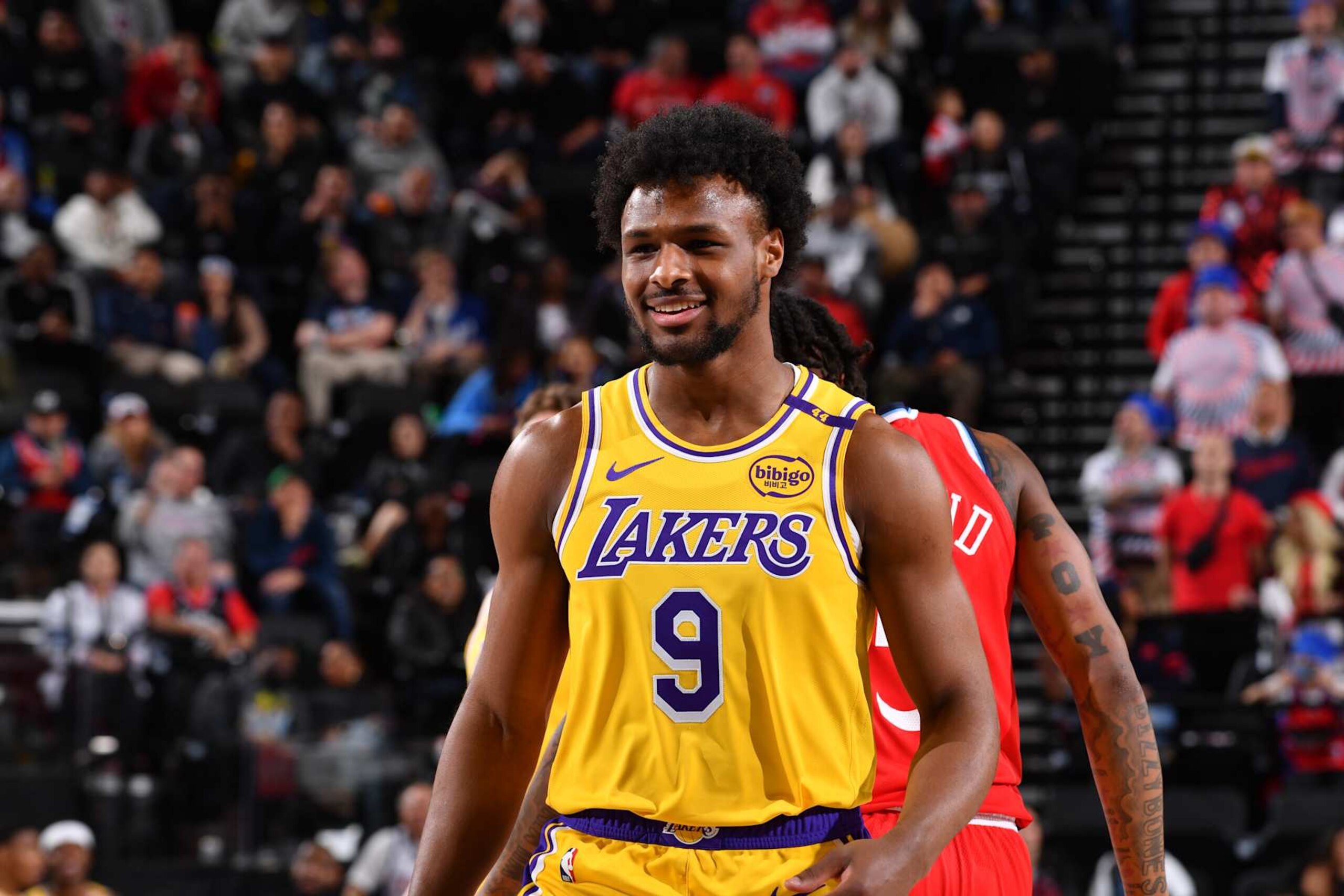 INGLEWOOD, CA - FEBRUARY 4: Bronny James #9 of the Los Angeles Lakers smiles during the game against the LA Clippers on February 4, 2025 at Intuit Dome in Los Angeles, California. NOTE TO USER: User expressly acknowledges and agrees that, by downloading and/or using this Photograph, user is consenting to the terms and conditions of the Getty Images License Agreement. Mandatory Copyright Notice: Copyright 2025 NBAE (Photo by Juan Ocampo/NBAE via Getty Images)
