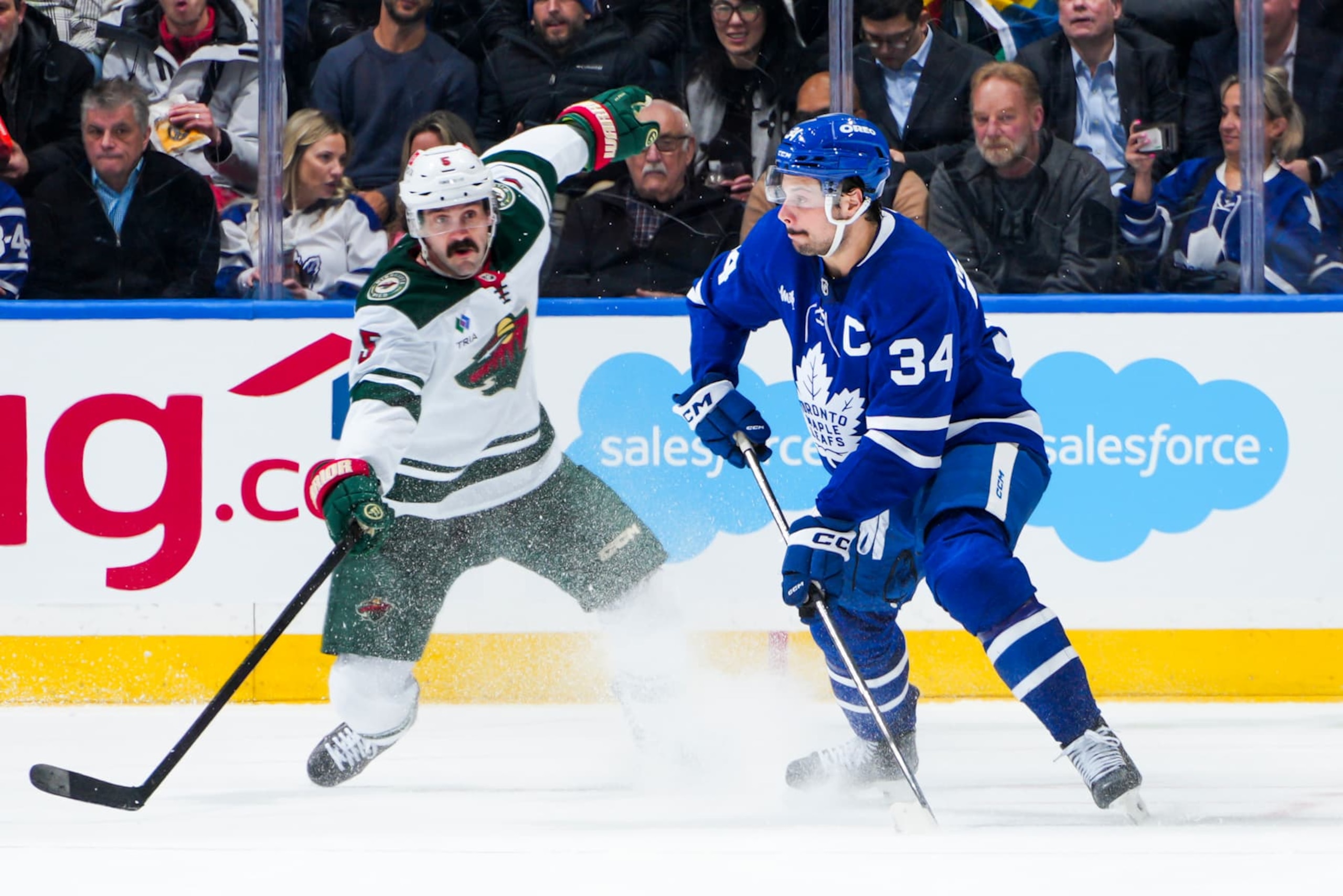 TORONTO, ON - JANUARY 29:  Auston Matthews #34 of the Toronto Maple Leafs plays the puck during the second period against the Minnesota Wild at the Scotiabank Arena on January 29, 2025 in Toronto, Ontario, Canada. (Photo by Thomas Skrlj/NHLI via Getty Images)