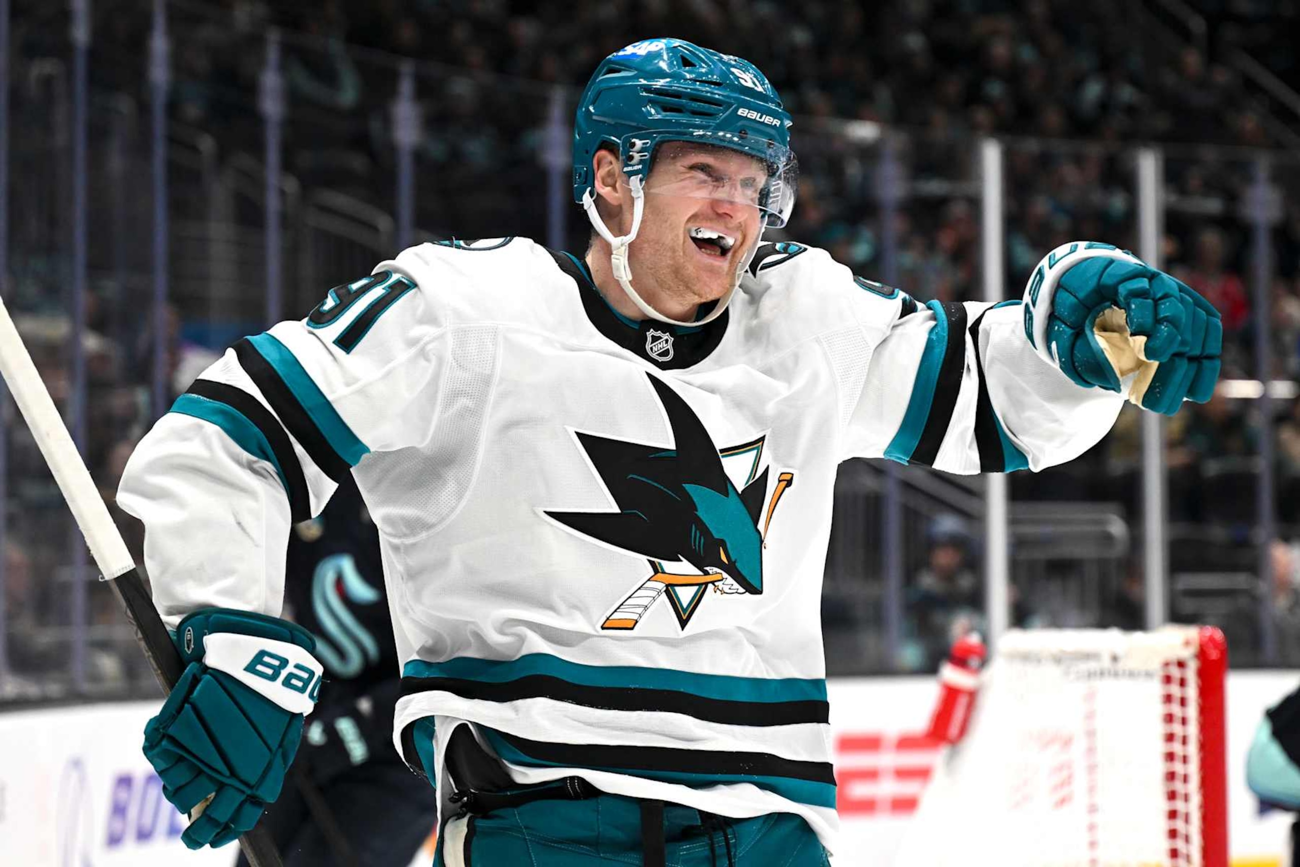 SEATTLE, WASHINGTON - JANUARY 30: Carl Grundstrom #91 of the San Jose Sharks reacts after scoring a goal during the first period against the Seattle Kraken at Climate Pledge Arena on January 30, 2025 in Seattle, Washington. (Photo by Alika Jenner/Getty Images)