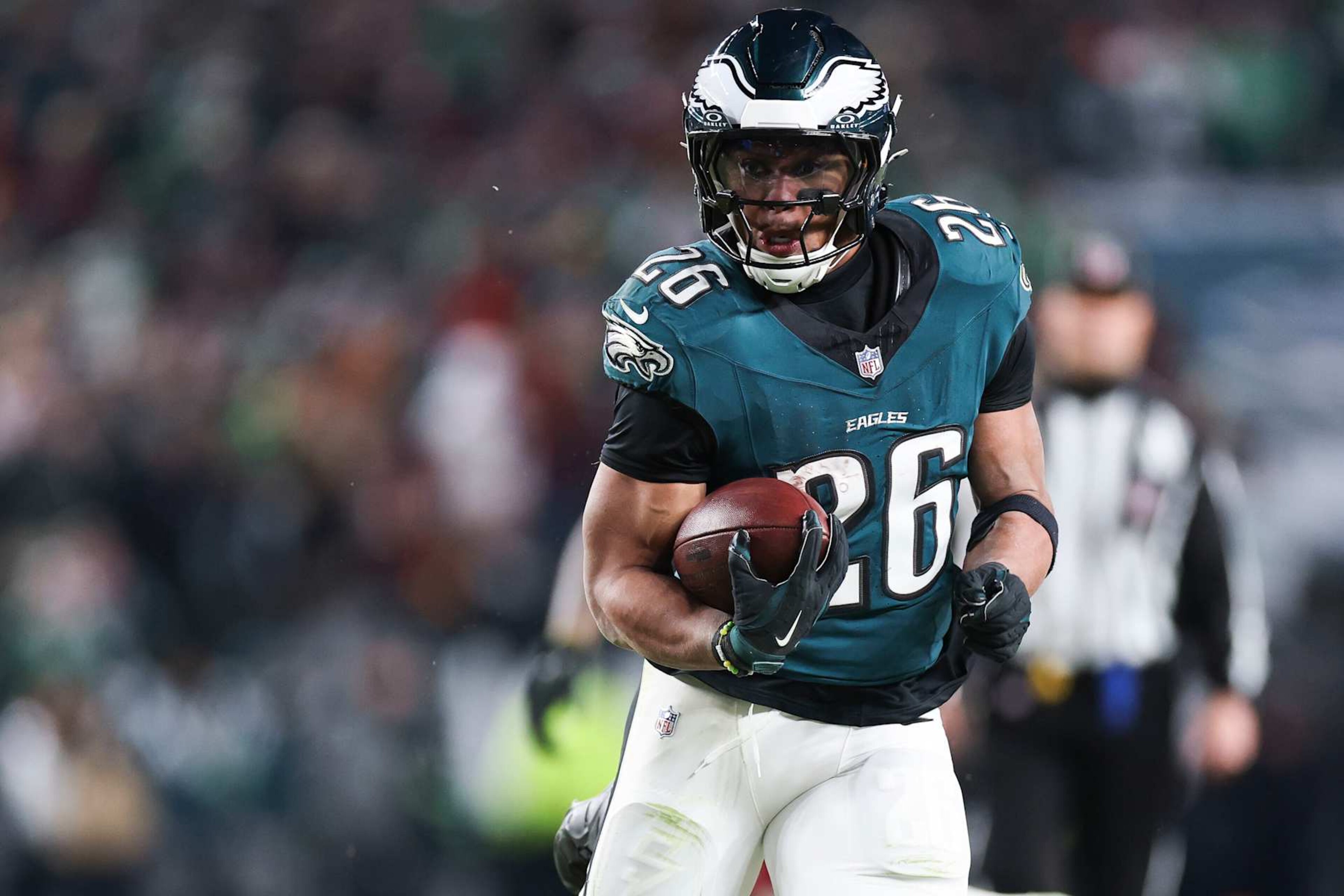 PHILADELPHIA, PENNSYLVANIA - JANUARY 26: Saquon Barkley #26 of the Philadelphia Eagles runs with the football during the fourth quarter in the NFC Championship Game against the Washington Commanders at Lincoln Financial Field on January 26, 2025 in Philadelphia, Pennsylvania. (Photo by Kathryn Riley/Getty Images) PHILADELPHIA, PENNSYLVANIA - JANUARY 26: Saquon Barkley #26 of the Philadelphia Eagles runs with the football during the fourth quarter in the NFC Championship Game against the Washington Commanders at Lincoln Financial Field on January 26, 2025 in Philadelphia, Pennsylvania. (Photo by Kathryn Riley/Getty Images)