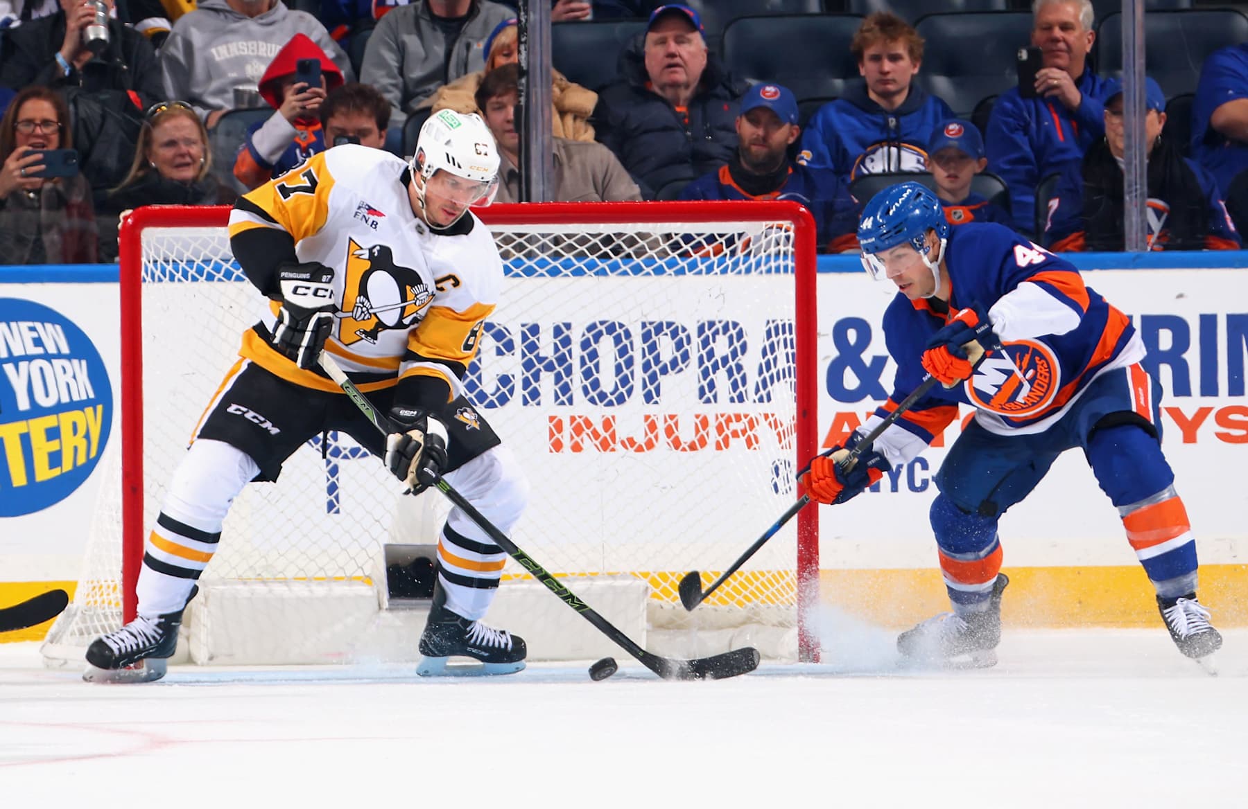 Pittsburgh Penguins captain Sidney Crosby (left) and New York Islanders center Jean-Gabriel Pageau. 