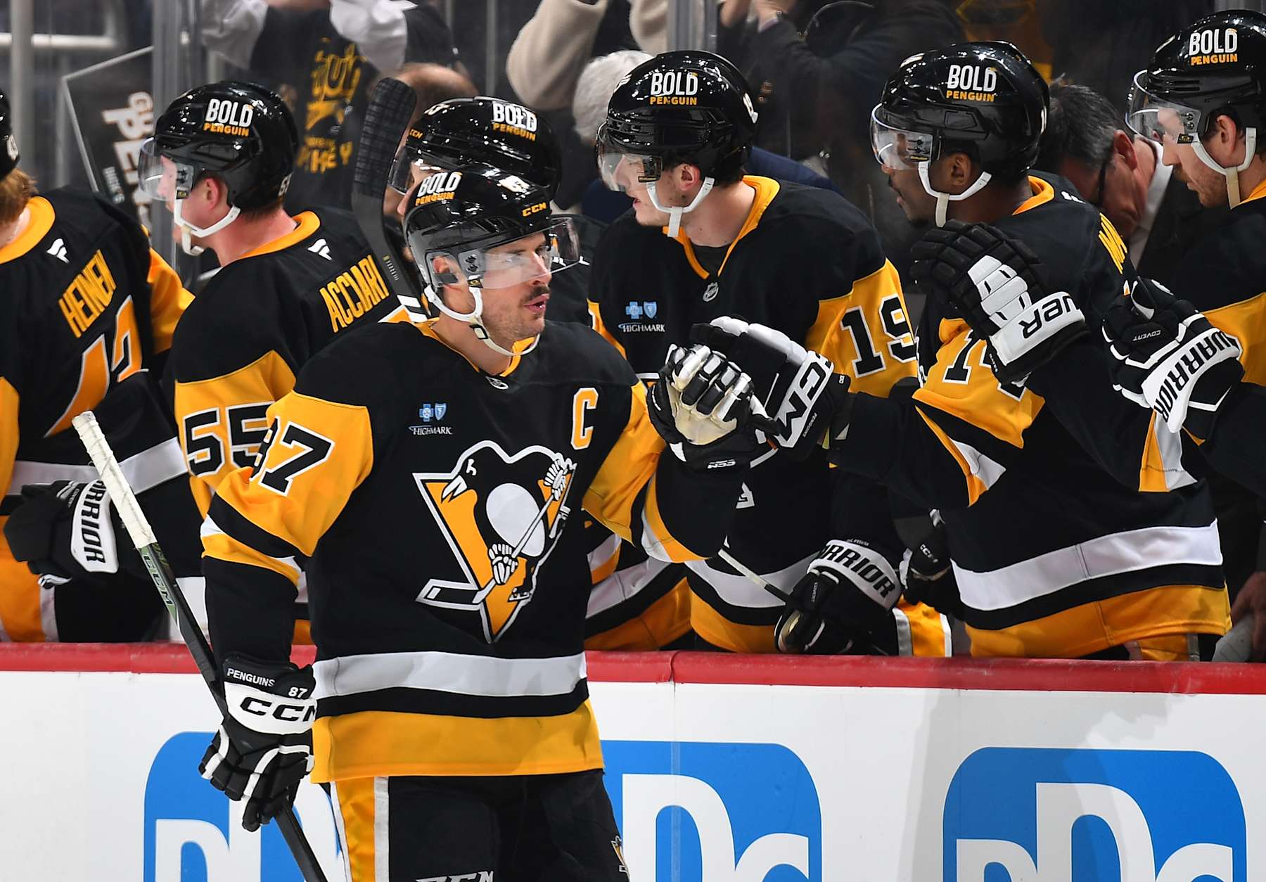 PITTSBURGH, PA - FEBRUARY 1: Sidney Crosby #87 of the Pittsburgh Penguins celebrates with teammates on the bench after scoring a goal in the second period during the game against the Nashville Predators at PPG PAINTS Arena on February 1, 2025 in Pittsburgh, Pennsylvania. (Photo by Joe Sargent/NHLI via Getty Images)