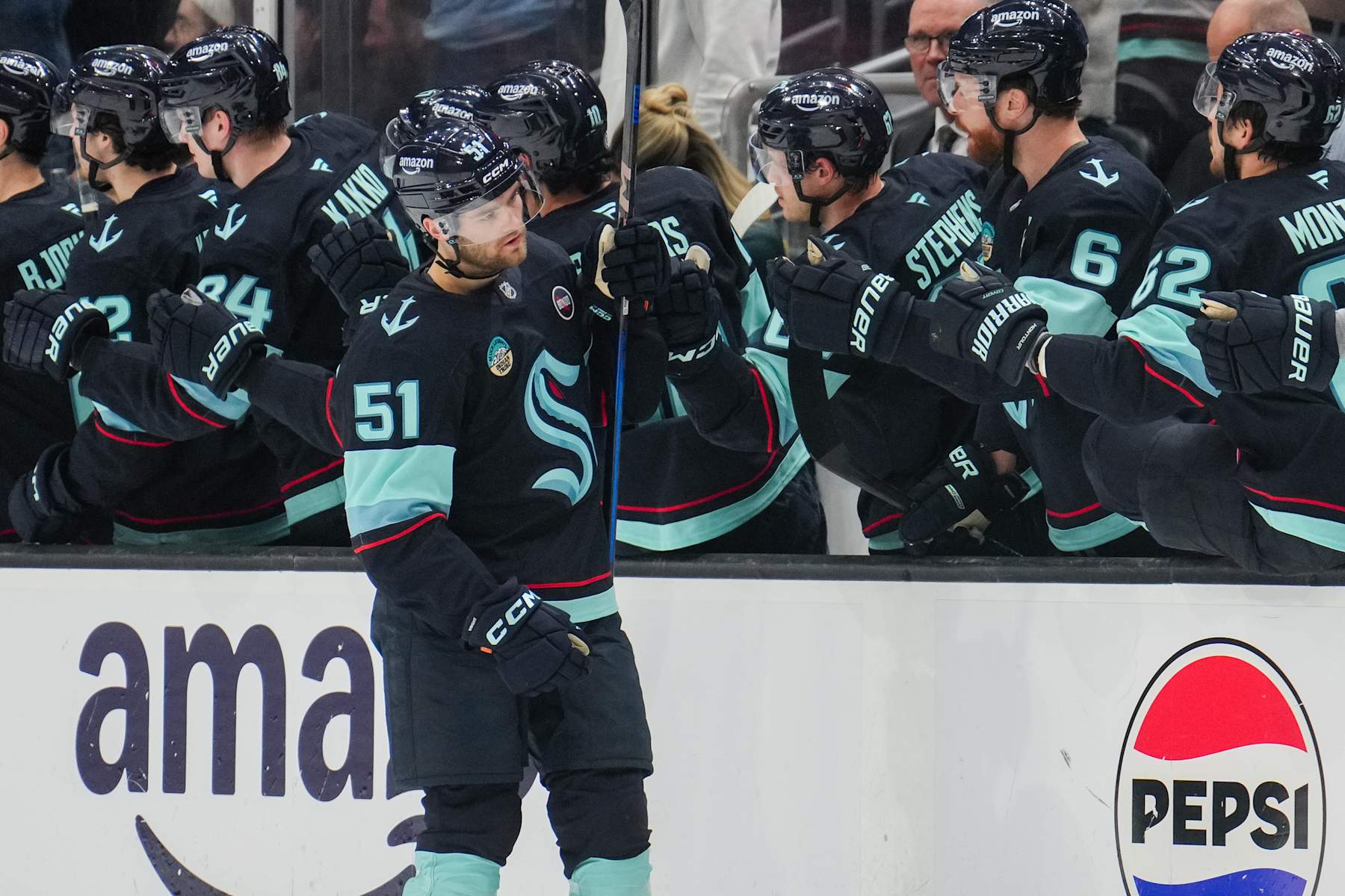 SEATTLE, WASHINGTON - FEBRUARY 04: Shane Wright #51 of the Seattle Kraken celebrates with teammates after scoring a goal during the second period of a game against the Detroit Red Wings at Climate Pledge Arena on February 4, 2025 in Seattle, Washington. (Photo by Christopher Mast/NHLI via Getty Images)