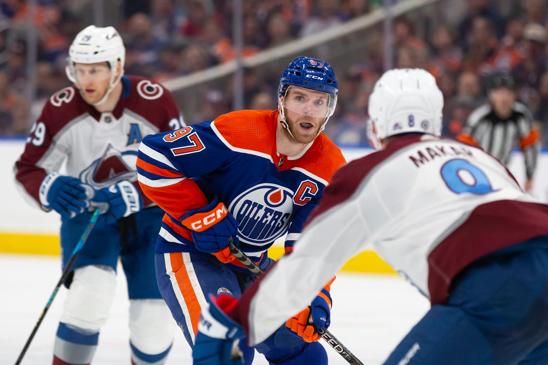 EDMONTON, CANADA - APRIL 5: Connor McDavid #97 of the Edmonton Oilers skates against Nathan MacKinnon #29 and Cale Makar #8 of the Colorado Avalanche during the second period at Rogers Place on April 5, 2024 in Edmonton, Canada. (Photo by Codie McLachlan/Getty Images)