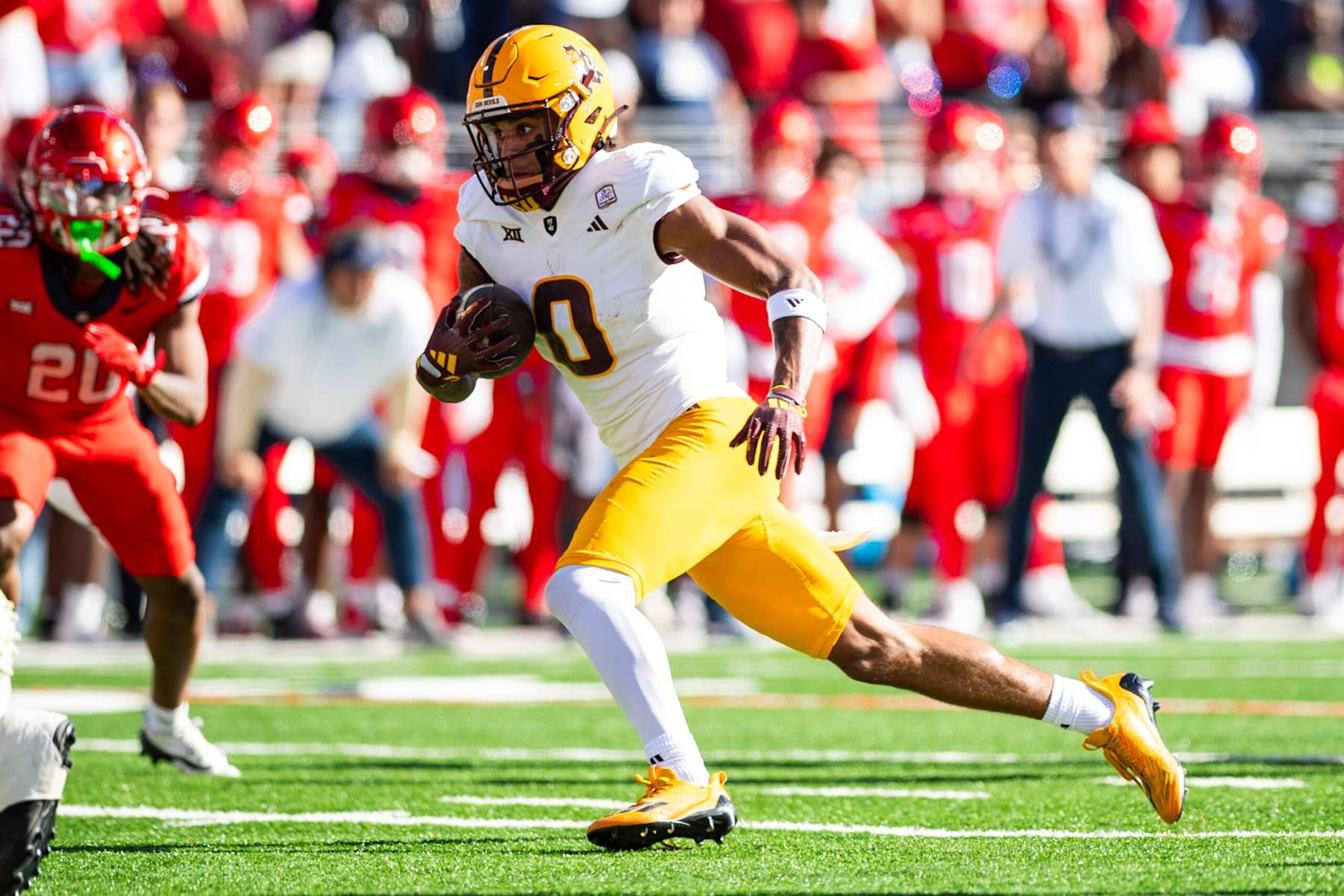 TUCSON, ARIZONA - NOVEMBER 30: Wide receiver Jordyn Tyson #0 of the Arizona State Sun Devils runs with the football during the first half of the NCAAF game against the Arizona Wildcats at Arizona Stadium on November 30, 2024 in Tucson, Arizona. The Suns Devils defeated the Wildcats 49-7. (Photo by Kelsey Grant/Getty Images) TUCSON, ARIZONA - NOVEMBER 30: Wide receiver Jordyn Tyson #0 of the Arizona State Sun Devils runs with the football during the first half of the NCAAF game against the Arizona Wildcats at Arizona Stadium on November 30, 2024 in Tucson, Arizona. The Suns Devils defeated the Wildcats 49-7. (Photo by Kelsey Grant/Getty Images)