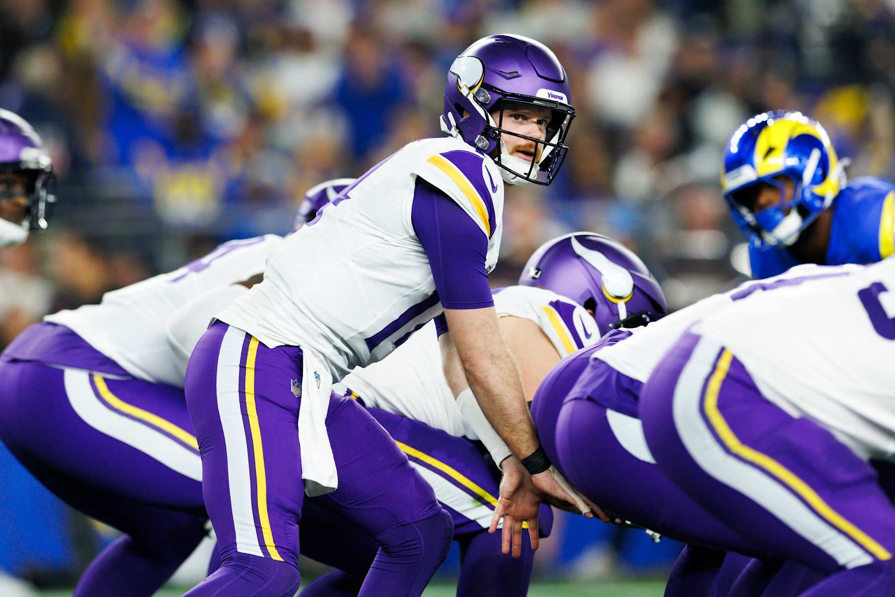 GLENDALE, ARIZONA - JANUARY 13: Sam Darnold #14 of the Minnesota Vikings under center during the first half of the NFC Wild Card Playoff game against the Los Angeles Rams at State Farm Stadium on January 13, 2025 in Glendale, Arizona. (Photo by Ric Tapia/Getty Images)