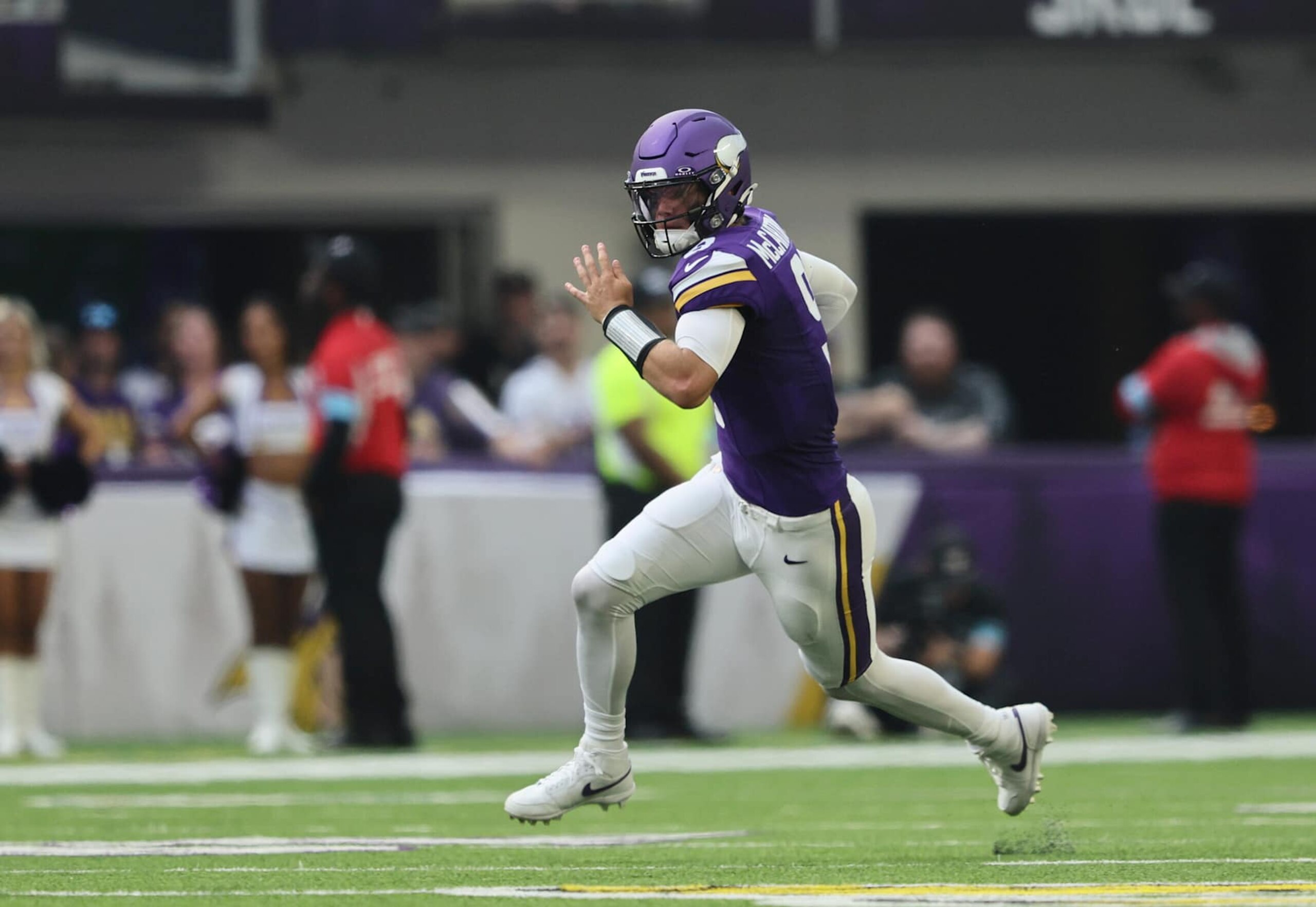 MINNEAPOLIS, MINNESOTA - AUGUST 10: J.J. McCarthy #9 of the Minnesota Vikings dives with the ball for a first down during the pre-season game against Las Vegas Raiders in the second half at U.S. Bank Stadium on August 10, 2024 in Minneapolis, Minnesota. J.J. McCarthys season was cut short due to a knee injury in the preseason game. (Photo by Adam Bettcher/Getty Images)