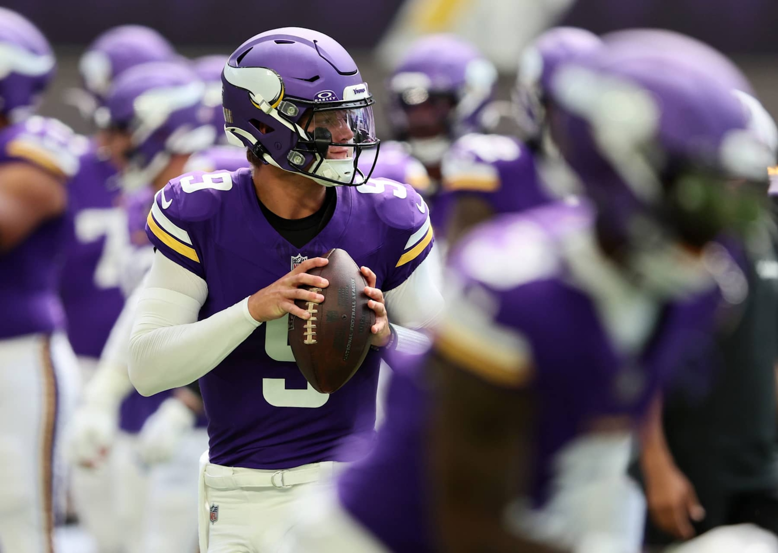 MINNEAPOLIS, MINNESOTA - AUGUST 10: J.J. McCarthy #9 of the Minnesota Vikings warms up before the pre-season game against Las Vegas Raiders at U.S. Bank Stadium on August 10, 2024 in Minneapolis, Minnesota. J.J. McCarthys season was cut short due to a knee injury in the preseason game. (Photo by Adam Bettcher/Getty Images)