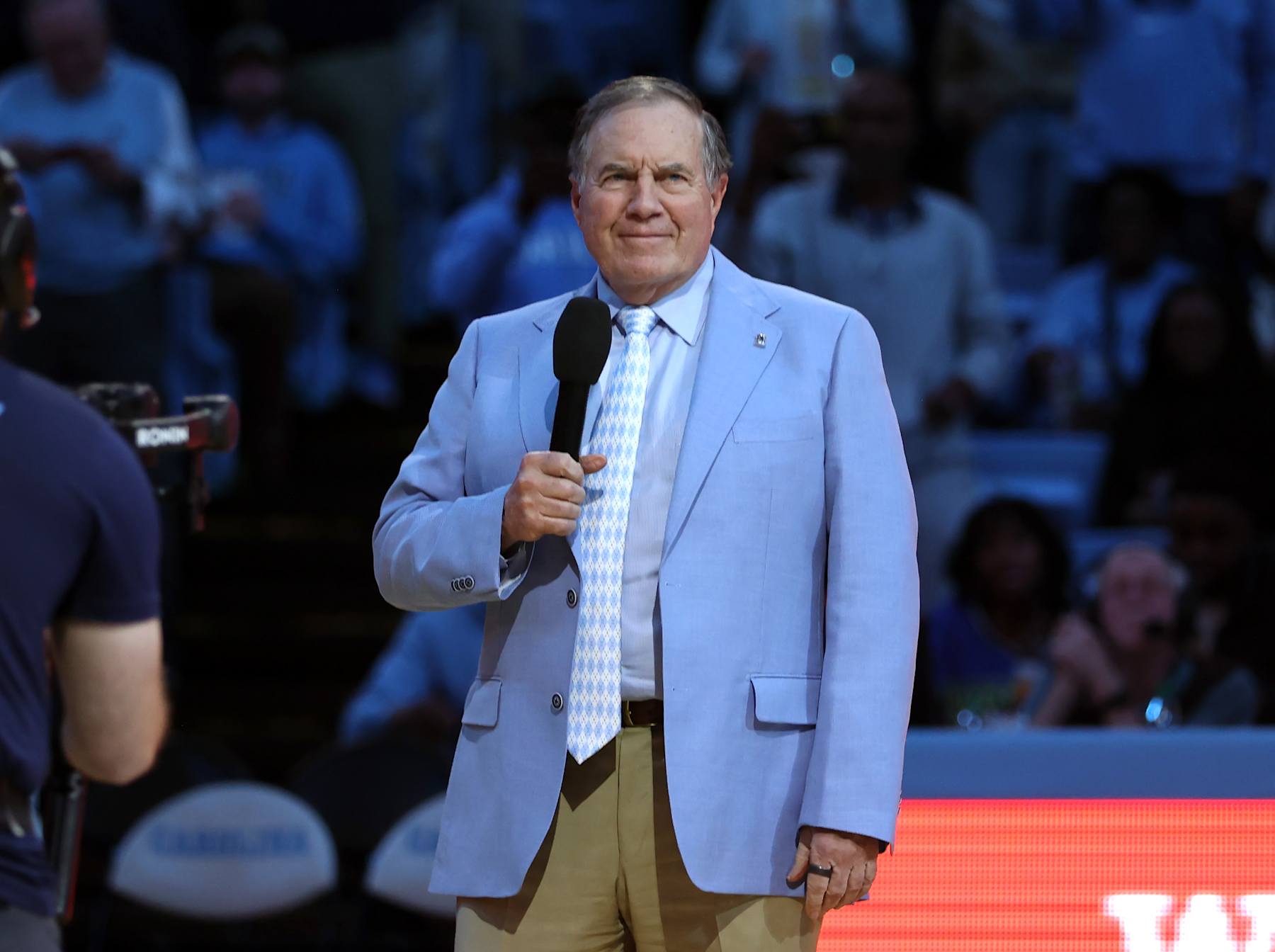 CHAPEL HILL, NC - DECEMBER 14: New University of North Carolina football head coach Bill Belichick is introduced during halftime of a men's basketball game between La Salle and North Carolina at Dean E.Smith Center on December 14, 2024 in Chapel Hill, North Carolina. (Photo by Andy Mead/ISI Photos/Getty Images)