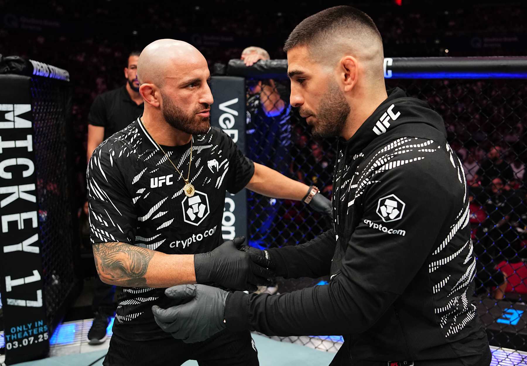 SYDNEY, AUSTRALIA - FEBRUARY 09: (L-R) Former opponents Alexander Volkanovski and Ilia Topuria talk after a bantamweight fight between Aleksandre Topuria and Colby Thicknesse during the UFC 312 event at Qudos Bank Arena on February 09, 2025 in Sydney, Australia. (Photo by Jeff Bottari/Zuffa LLC) SYDNEY, AUSTRALIA - FEBRUARY 09: (L-R) Former opponents Alexander Volkanovski and Ilia Topuria talk after a bantamweight fight between Aleksandre Topuria and Colby Thicknesse during the UFC 312 event at Qudos Bank Arena on February 09, 2025 in Sydney, Australia. (Photo by Jeff Bottari/Zuffa LLC)