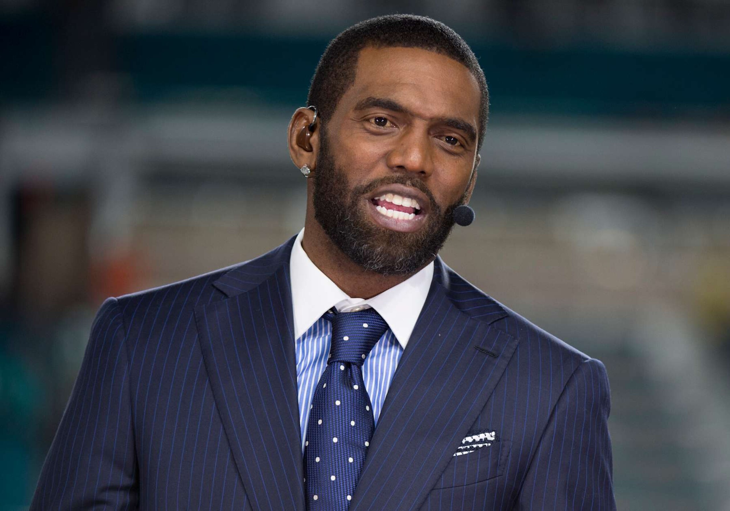 MIAMI GARDENS, FL - DECEMBER 11: ESPN NFL Analyst Randy Moss during the ESPN Monday Night Football Countdown TV show on the field before the start of the NFL football game between the New England Patriots and the Miami Dolphins on December 11, 2017, at the Hard Rock Stadium in Miami Gardens, FL. (Photo by Doug Murray/Icon Sportswire via Getty Images)