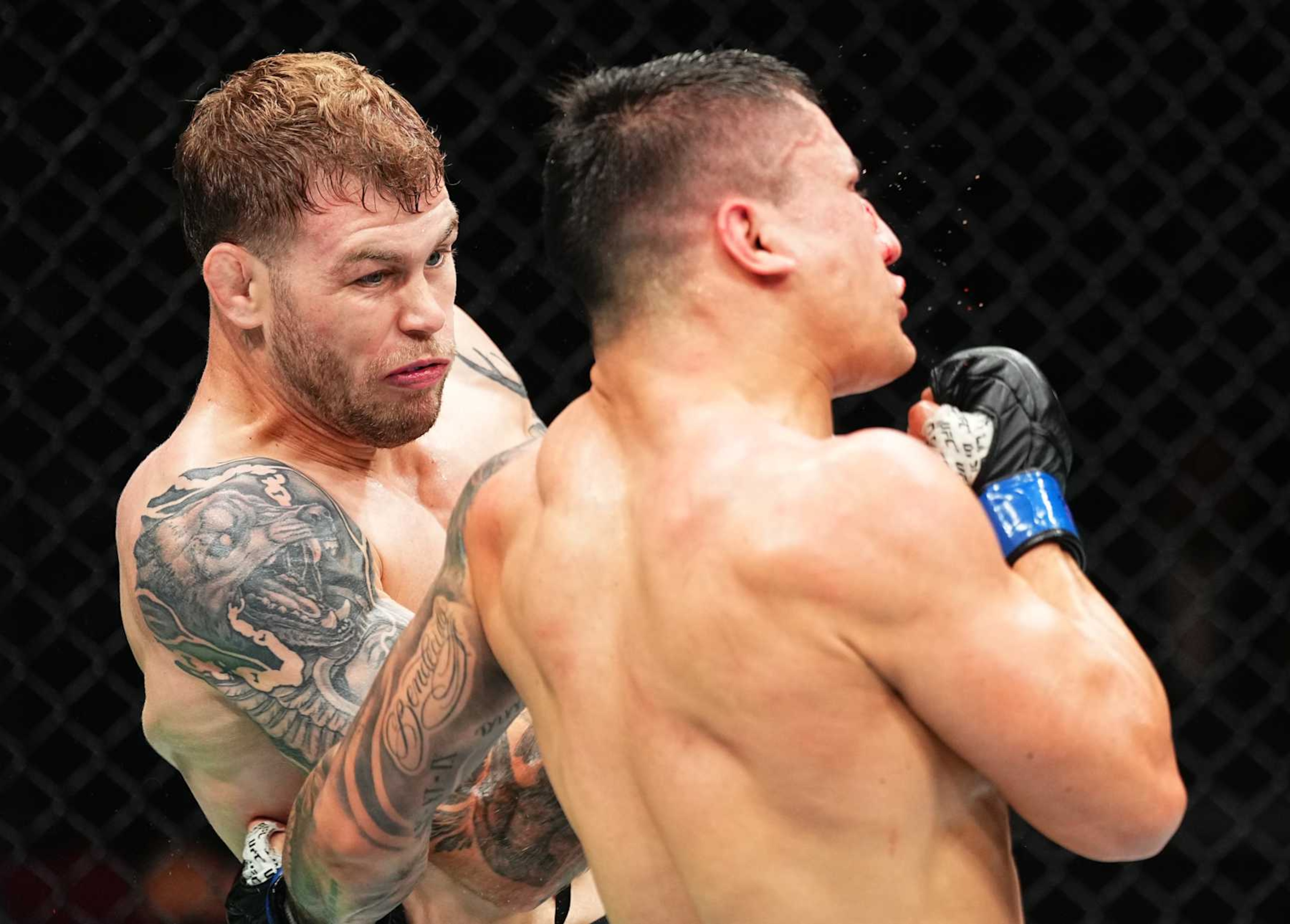 SYDNEY, AUSTRALIA - FEBRUARY 09: (L-R) Jake Matthews of Australia punches Francisco Prado of Argentina in a welterweight fight during the UFC 312 event at Qudos Bank Arena on February 09, 2025 in Sydney, Australia.  (Photo by Jeff Bottari/Zuffa LLC)
