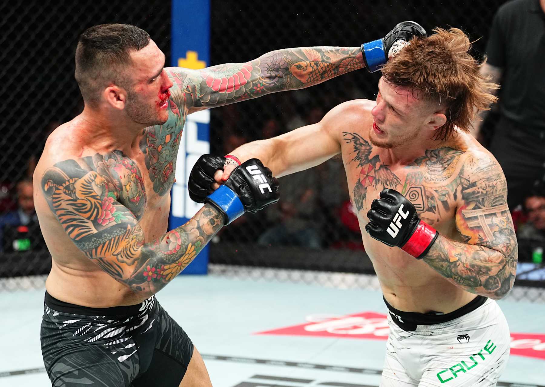 SYDNEY, AUSTRALIA - FEBRUARY 09: (L-R) Rodolfo Bellato of Brazil punches Jimmy Crute of Australia in a light heavyweight fight during the UFC 312 event at Qudos Bank Arena on February 09, 2025 in Sydney, Australia. (Photo by Jeff Bottari/Zuffa LLC) SYDNEY, AUSTRALIA - FEBRUARY 09: (L-R) Rodolfo Bellato of Brazil punches Jimmy Crute of Australia in a light heavyweight fight during the UFC 312 event at Qudos Bank Arena on February 09, 2025 in Sydney, Australia. (Photo by Jeff Bottari/Zuffa LLC)