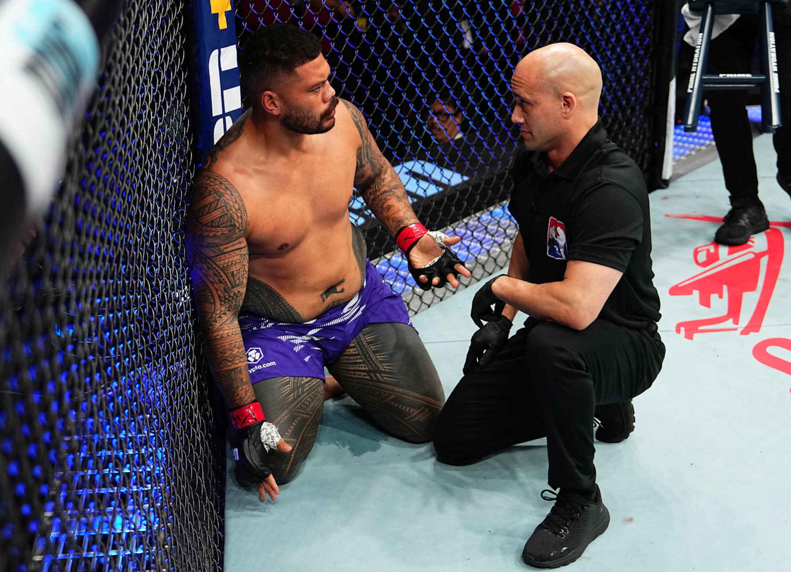 SYDNEY, AUSTRALIA - FEBRUARY 09: Justin Tafa of New Zealand protests after a knockout loss against Tallison Teixeira of Brazil in a heavyweight fight during the UFC 312 event at Qudos Bank Arena on February 09, 2025 in Sydney, Australia. (Photo by Jeff Bottari/Zuffa LLC) SYDNEY, AUSTRALIA - FEBRUARY 09: Justin Tafa of New Zealand protests after a knockout loss against Tallison Teixeira of Brazil in a heavyweight fight during the UFC 312 event at Qudos Bank Arena on February 09, 2025 in Sydney, Australia. (Photo by Jeff Bottari/Zuffa LLC)