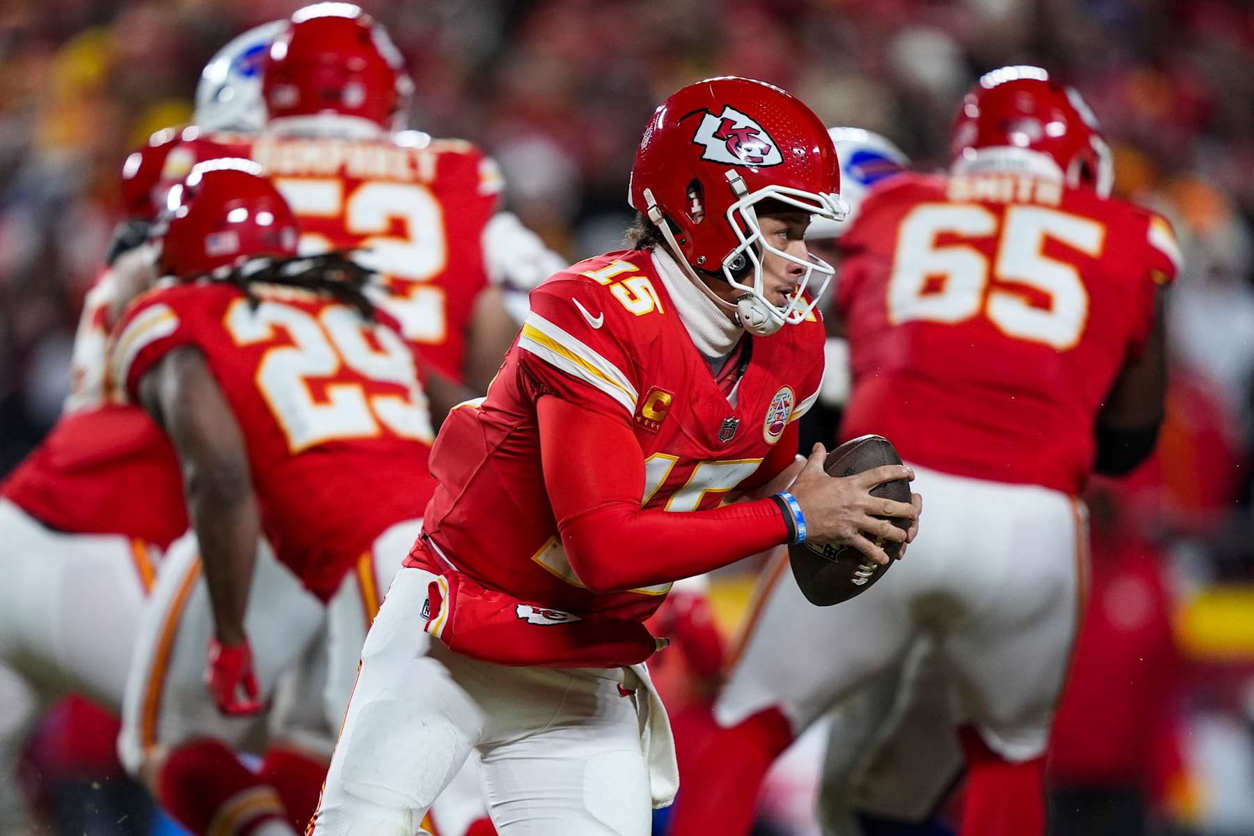 KANSAS CITY, MISSOURI - JANUARY 26: Patrick Mahomes #15 of the Kansas City Chiefs scrambles out of the pocket during the AFC Championship NFL football game against the Buffalo Bills at GEHA Field at Arrowhead Stadium on January 26, 2025 in Kansas City, Missouri. (Photo by Perry Knotts/Getty Images)