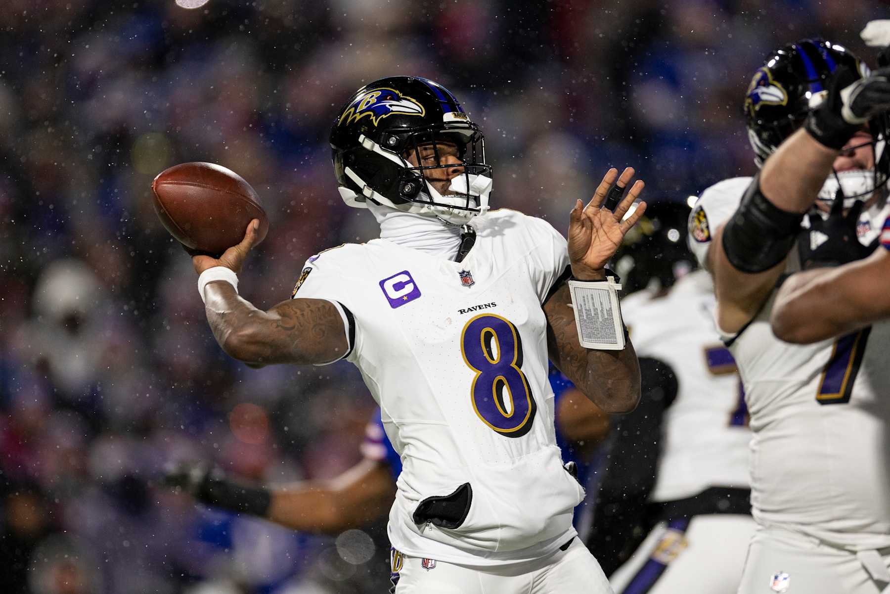 ORCHARD PARK, NEW YORK - JANUARY 19: Lamar Jackson #8 of the Baltimore Ravens looks to pass during an NFL Football game against the Buffalo Bills at Highmark Stadium on January 19, 2025 in Orchard Park, New York. (Photo by Michael Owens/Getty Images)