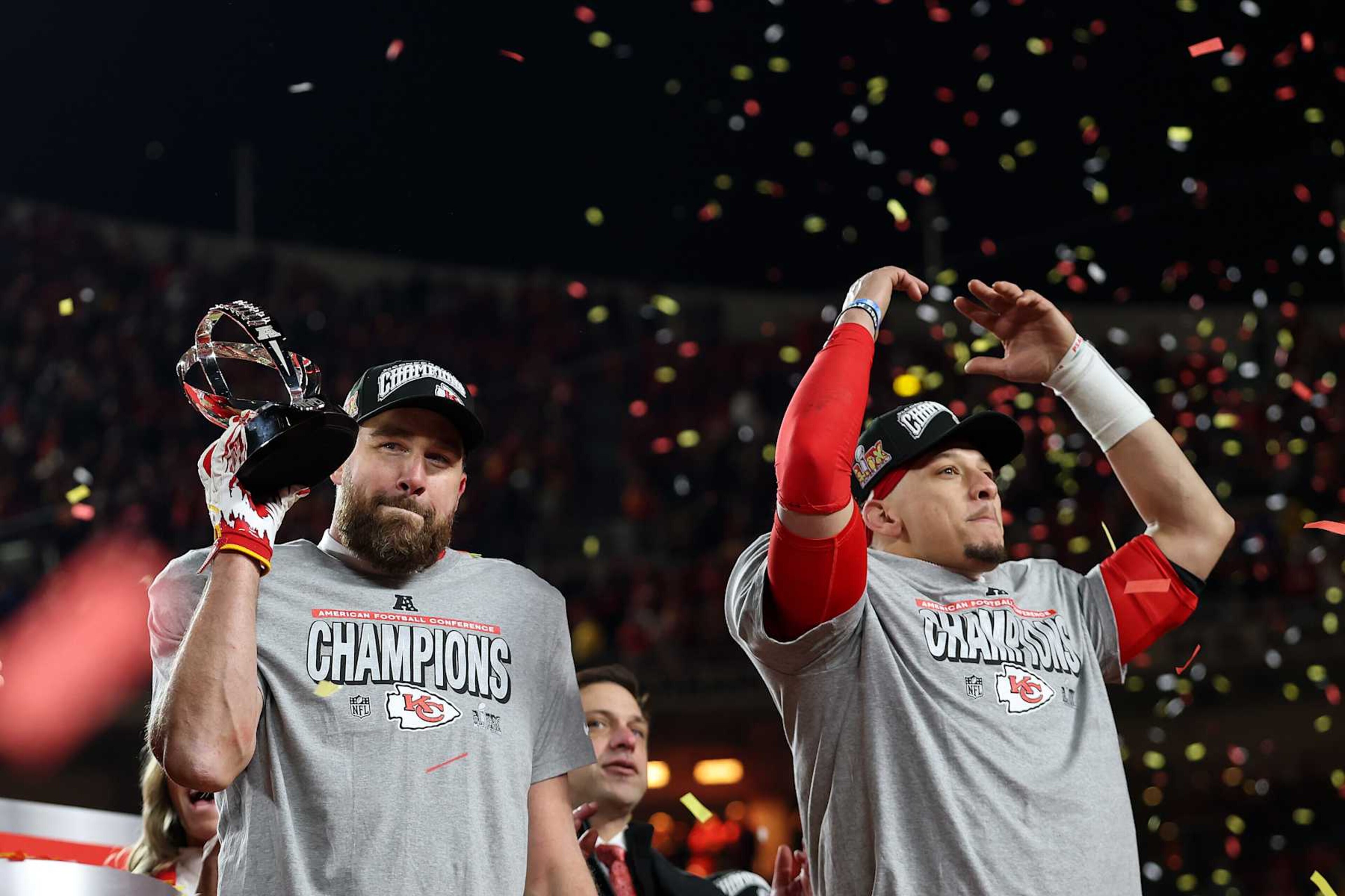 KANSAS CITY, MISSOURI - JANUARY 26: (L-R) Travis Kelce #87 of the Kansas City Chiefs raises the Lamar Hunt Trophy as he celebrates with Patrick Mahomes #15 after defeating the Buffalo Bills 32-29 in the AFC Championship Game at GEHA Field at Arrowhead Stadium on January 26, 2025 in Kansas City, Missouri.  (Photo by Jamie Squire/Getty Images)