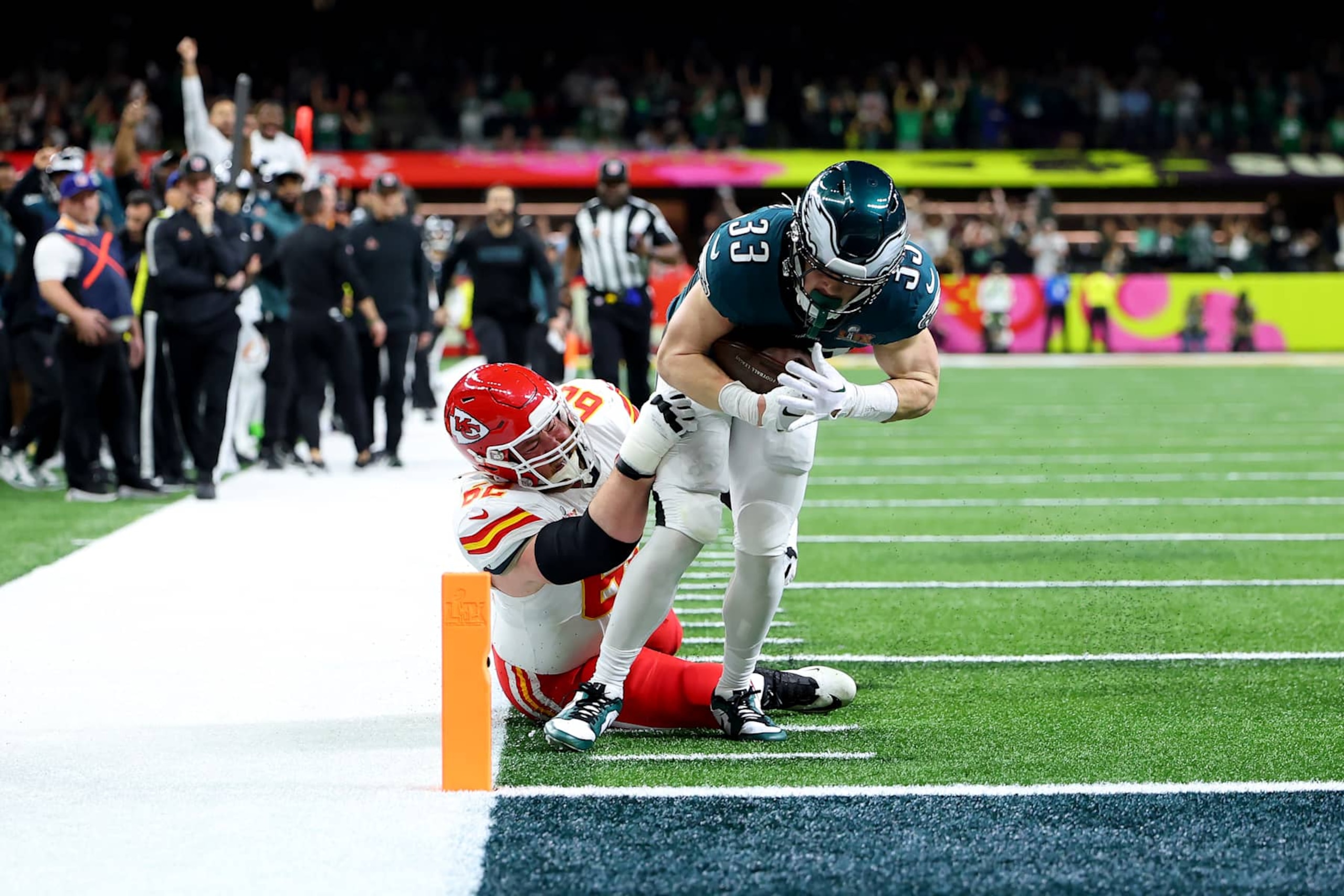 NEW ORLEANS, LOUISIANA - FEBRUARY 09: Cooper DeJean #33 of the Philadelphia Eagles scores a touchdown past Joe Thuney #62 of the Kansas City Chiefs after making an interception in the second quarter during Super Bowl LIX at Caesars Superdome on February 09, 2025 in New Orleans, Louisiana. (Photo by Gregory Shamus/Getty Images)