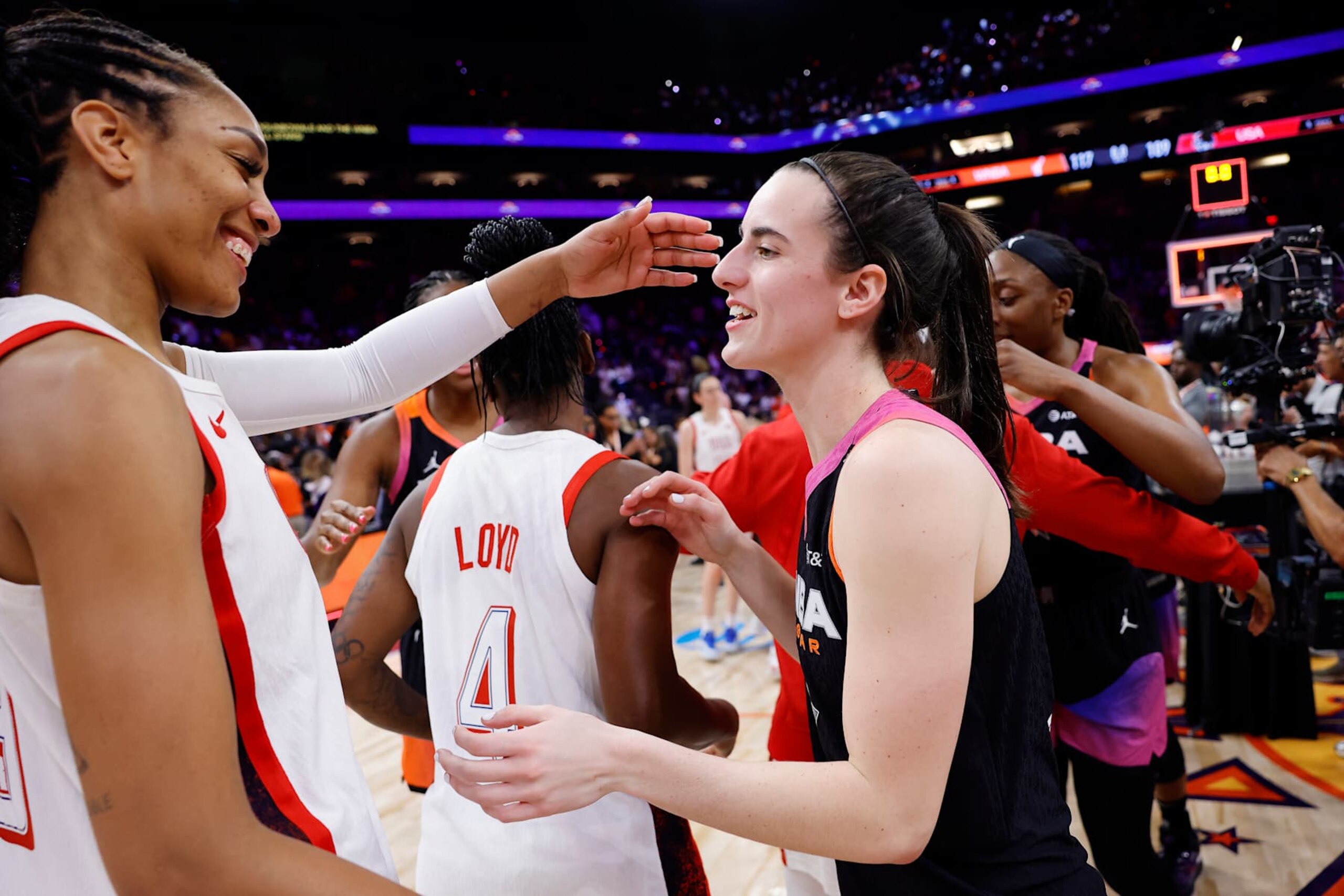 PHOENIX, ARIZONA - JULY 20: Caitlin Clark #22 of Team WNBA hugs A’ja Wilson #9 of Team USA after the 2024 WNBA All Star Game at Footprint Center on July 20, 2024 in Phoenix, Arizona.  (Photo by Alex Slitz/Getty Images)