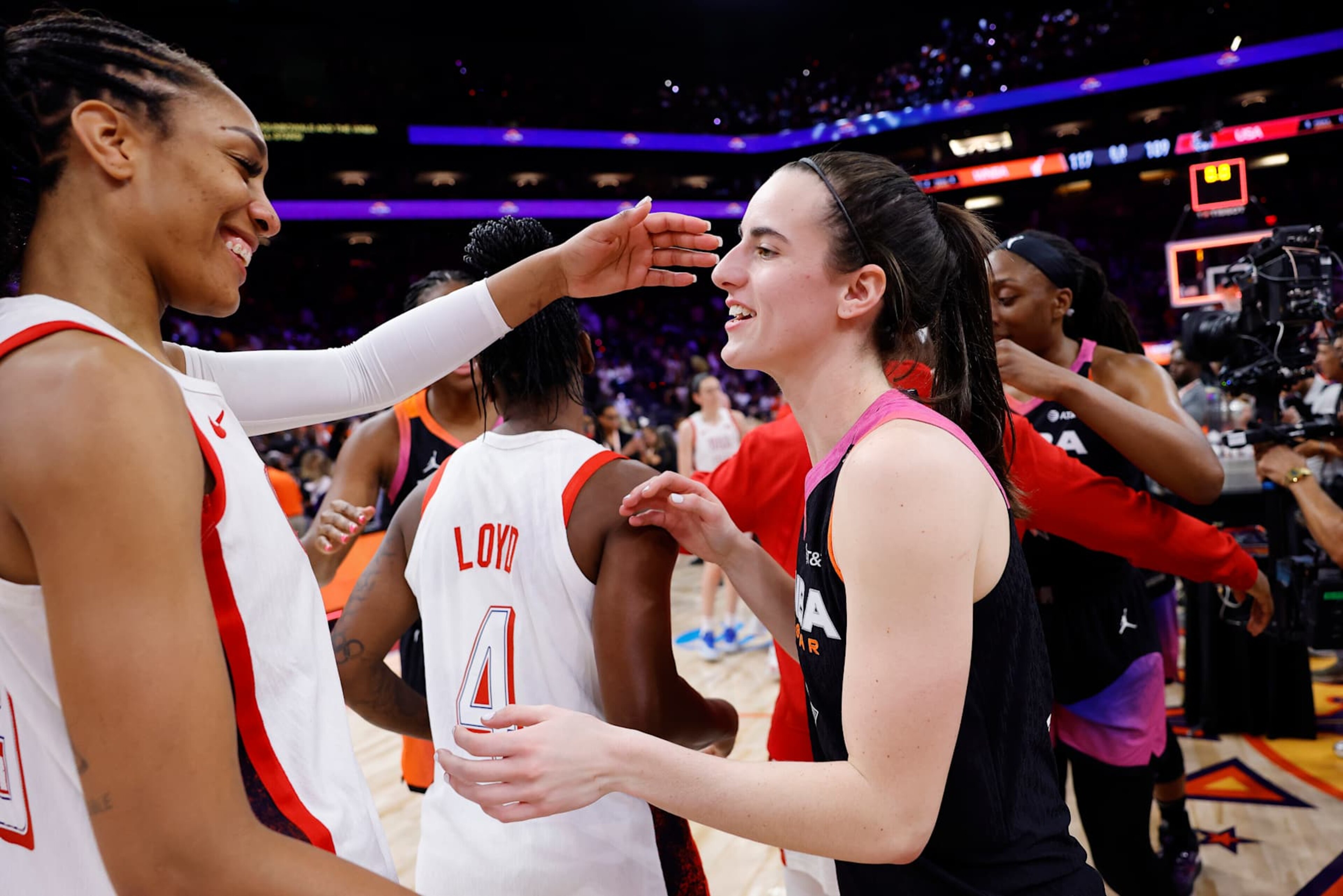 PHOENIX, ARIZONA - JULY 20: Caitlin Clark #22 of Team WNBA hugs A’ja Wilson #9 of Team USA after the 2024 WNBA All Star Game at Footprint Center on July 20, 2024 in Phoenix, Arizona.  (Photo by Alex Slitz/Getty Images)