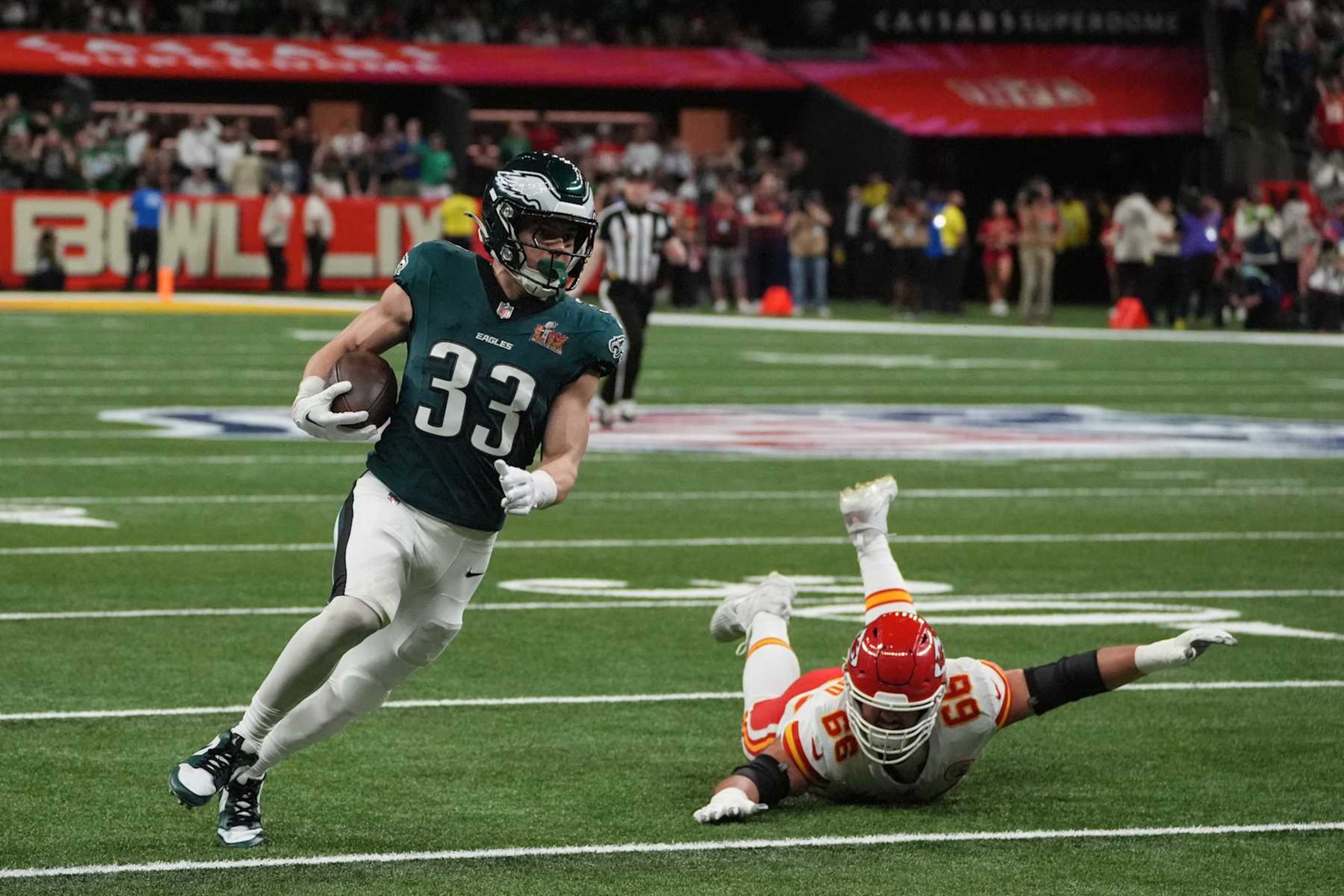 TOPSHOT - Philadelphia Eagles' defensive back #33 Cooper DeJean returns an interception for a touchdown during Super Bowl LIX between the Kansas City Chiefs and the Philadelphia Eagles at Caesars Superdome in New Orleans, Louisiana, February 9, 2025. (Photo by TIMOTHY A. CLARY / AFP) (Photo by TIMOTHY A. CLARY/AFP via Getty Images)          