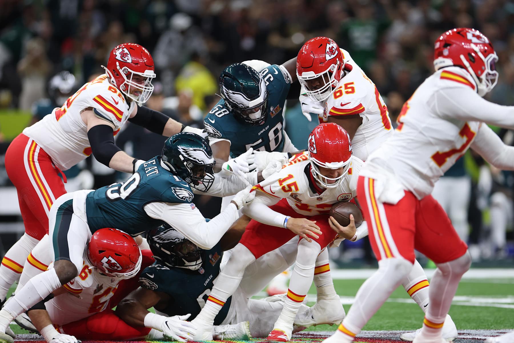 NEW ORLEANS, LOUISIANA - FEBRUARY 09: Patrick Mahomes #15 of the Kansas City Chiefs is sacked by Josh Sweat #19 and Jalyx Hunt #58 of the Philadelphia Eagles in the second quarter during Super Bowl LIX at Caesars Superdome on February 09, 2025 in New Orleans, Louisiana. (Photo by Jamie Squire/Getty Images)