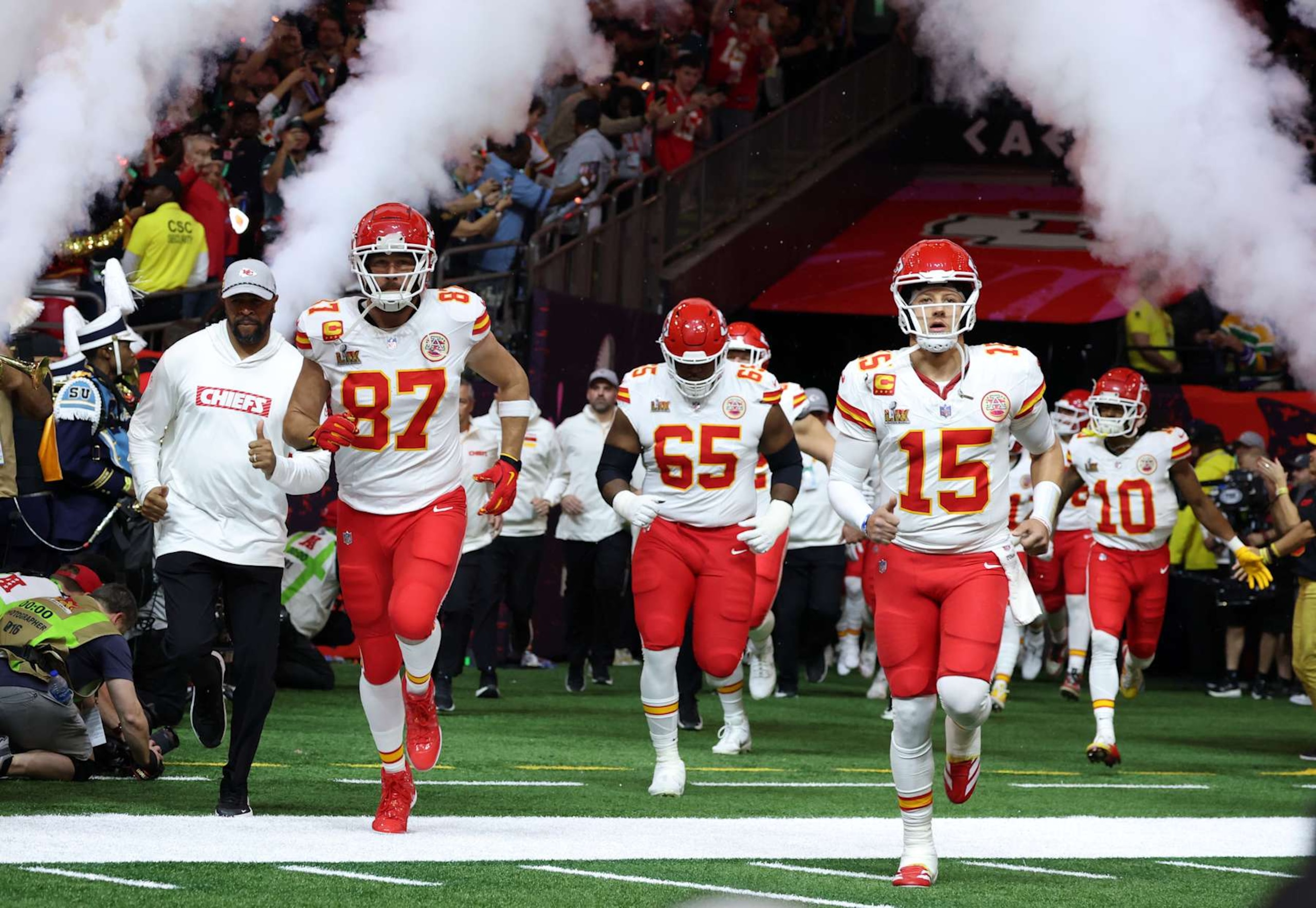 NEW ORLEANS, LOUISIANA - FEBRUARY 09: Travis Kelce, Trey Smith, Patrick Mahomes, Isiah Pacheco, and the Kansas City Chiefs team enter the field during the Super Bowl LIX Pregame at Caesars Superdome on February 09, 2025 in New Orleans, Louisiana.  (Photo by Kevin Mazur/Getty Images for Roc Nation)
