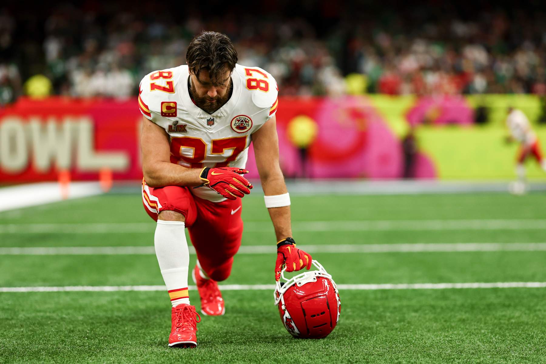 NEW ORLEANS, LOUISIANA - FEBRUARY 9: Travis Kelce #87 of the Kansas City Chiefs kneels on the field before Super Bowl LIX at Caesars Superdome on February 9, 2025 in New Orleans, Louisiana. (Photo by Kevin Sabitus/Getty Images)