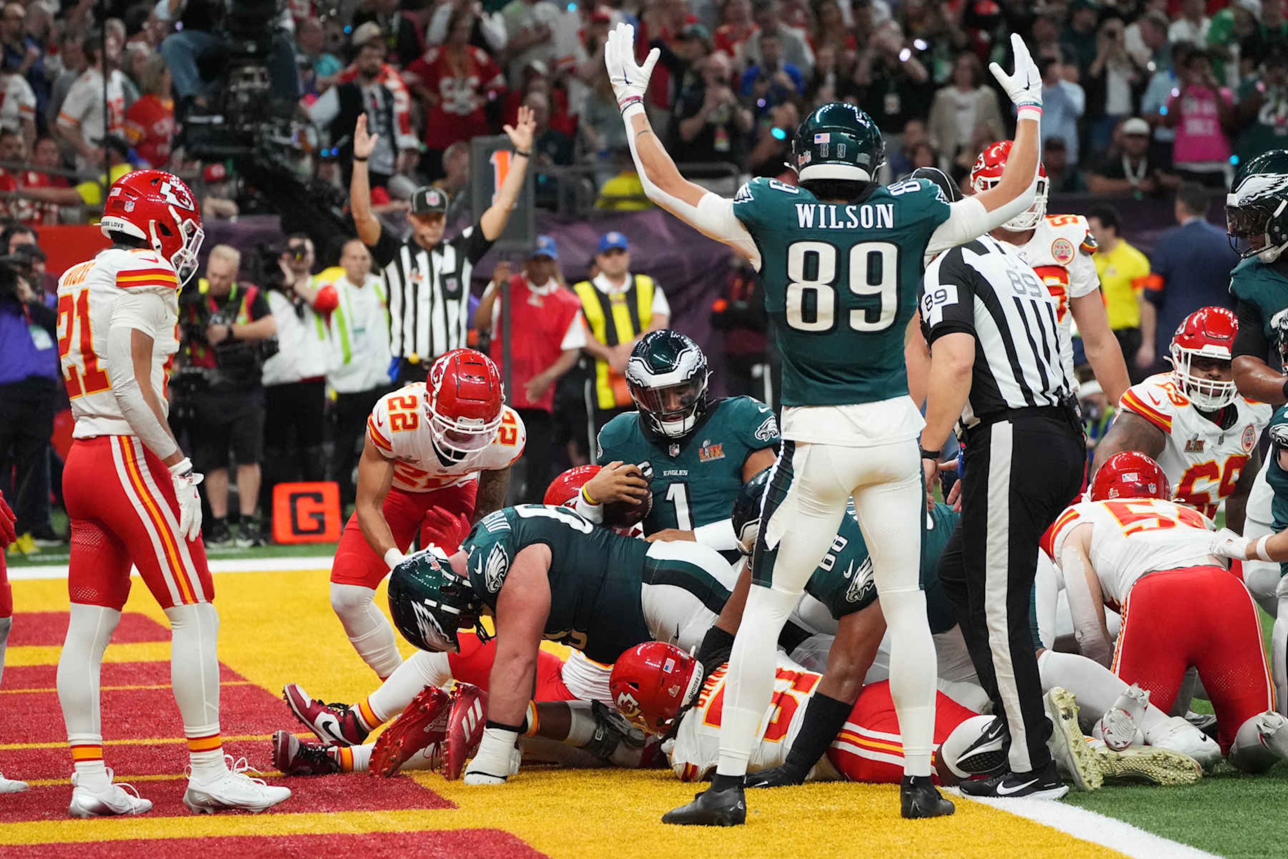 Philadelphia Eagles' quarterback #01 Jalen Hurts rushes for a touchdown as Philadelphia Eagles' wide receiver #89 Johnny Wilson celebrates during Super Bowl LIX between the Kansas City Chiefs and the Philadelphia Eagles at Caesars Superdome in New Orleans, Louisiana, February 9, 2025. (Photo by TIMOTHY A. CLARY / AFP) (Photo by TIMOTHY A. CLARY/AFP via Getty Images)          