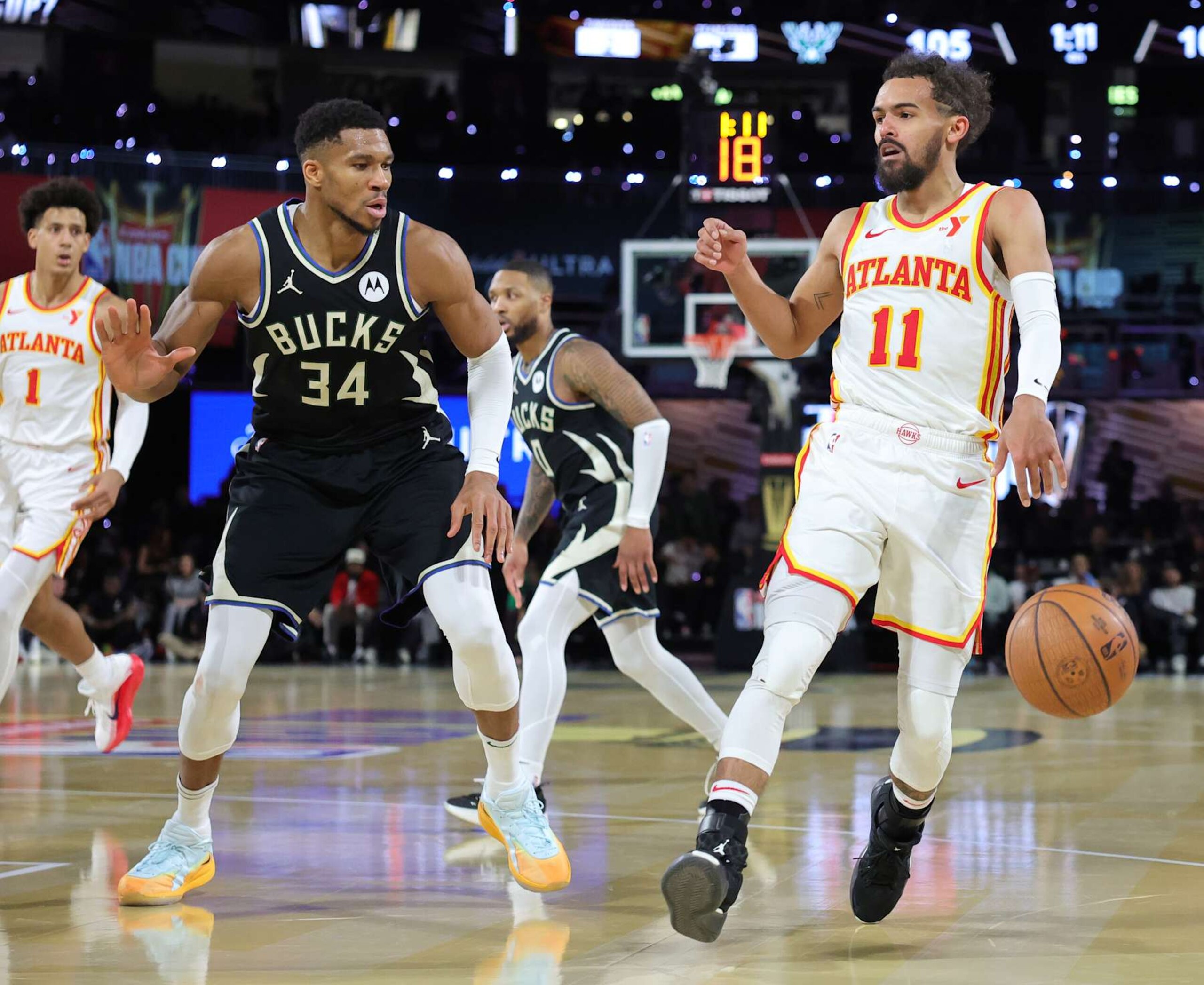 LAS VEGAS, NEVADA - DECEMBER 14: Trae Young #11 of the Atlanta Hawks drives against Giannis Antetokounmpo #34 of the Milwaukee Bucks in the second half of a semifinal game of the Emirates NBA Cup at T-Mobile Arena on December 14, 2024 in Las Vegas, Nevada. The Bucks defeated the Hawks 110-102. NOTE TO USER: User expressly acknowledges and agrees that, by downloading and or using this photograph, User is consenting to the terms and conditions of the Getty Images License Agreement. (Photo by Ethan Miller/Getty Images) LAS VEGAS, NEVADA - DECEMBER 14: Trae Young #11 of the Atlanta Hawks drives against Giannis Antetokounmpo #34 of the Milwaukee Bucks in the second half of a semifinal game of the Emirates NBA Cup at T-Mobile Arena on December 14, 2024 in Las Vegas, Nevada. The Bucks defeated the Hawks 110-102. NOTE TO USER: User expressly acknowledges and agrees that, by downloading and or using this photograph, User is consenting to the terms and conditions of the Getty Images License Agreement. (Photo by Ethan Miller/Getty Images)