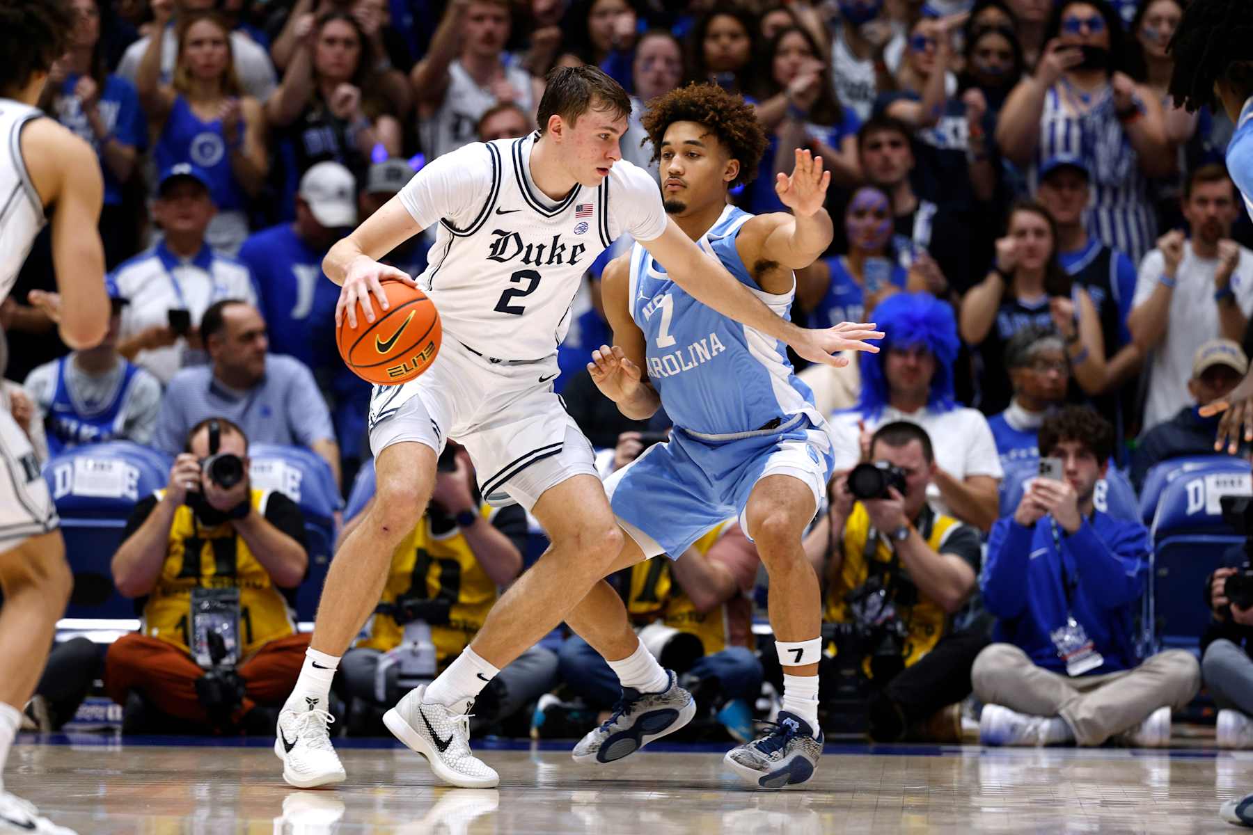 DURHAM, NORTH CAROLINA - FEBRUARY 01: CooperÂ Flagg #2 of the Duke Blue Devils moves the ball against Seth Trimble #7 of the North Carolina Tar Heels during the second half at Cameron Indoor Stadium on February 1, 2025 in Durham, North Carolina. (Photo by Lance King/Getty Images)