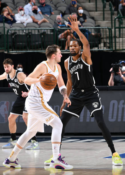 DALLAS, TX - MAY 6: Kevin Durant #7 of the Brooklyn Nets plays defense on Luka Doncic #77 of the Dallas Mavericks during the game on May 6, 2021 at the American Airlines Center in Dallas, Texas. NOTE TO USER: User expressly acknowledges and agrees that, by downloading and or using this photograph, User is consenting to the terms and conditions of the Getty Images License Agreement. Mandatory Copyright Notice: Copyright 2021 NBAE (Photo by Glenn James/NBAE via Getty Images)