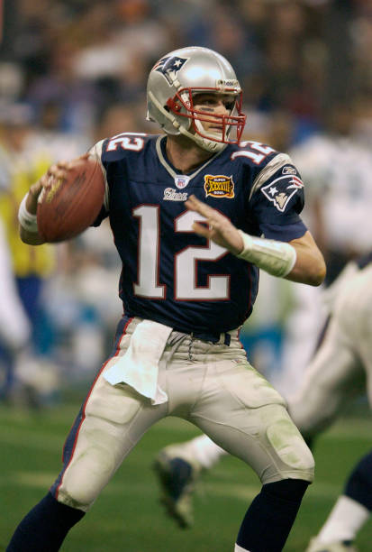 HOUSTON, TX - FEBRUARY 01: Tom Brady #12 of the New England Patriots drops back to pass against the Carolina Panthers during Super Bowl XXXVIII at Reliant Stadium on February 1, 2004 in Houston, Texas. The Patriots won the game 32-29. (Photo by Focus on Sport/Getty Images) 