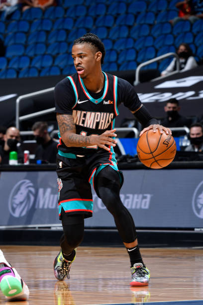 ORLANDO, FL - MAY 1: Ja Morant #12 of the Memphis Grizzlies handles the ball against the Orlando Magic on May 1, 2021 at Amway Center in Orlando, Florida. NOTE TO USER: User expressly acknowledges and agrees that, by downloading and or using this photograph, User is consenting to the terms and conditions of the Getty Images License Agreement. Mandatory Copyright Notice: Copyright 2021 NBAE (Photo by Fernando Medina/NBAE via Getty Images)