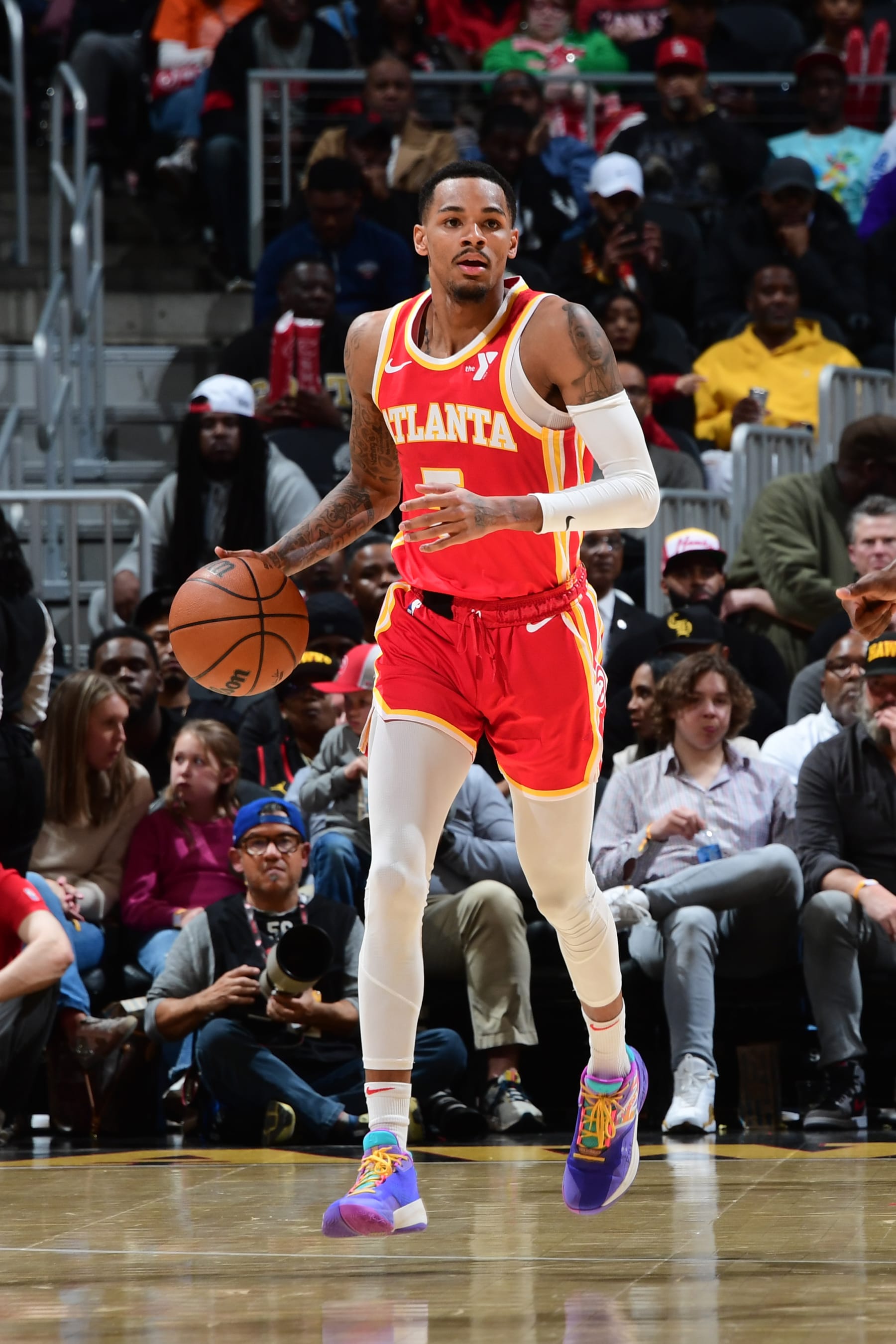 ATLANTA, GA - MARCH 10: Dejounte Murray #5 of the Atlanta Hawks dribbles the ball during the game against the New Orleans Pelicans on March 10, 2024 at State Farm Arena in Atlanta, Georgia.  NOTE TO USER: User expressly acknowledges and agrees that, by downloading and/or using this Photograph, user is consenting to the terms and conditions of the Getty Images License Agreement. Mandatory Copyright Notice: Copyright 2024 NBAE (Photo by Scott Cunningham/NBAE via Getty Images)