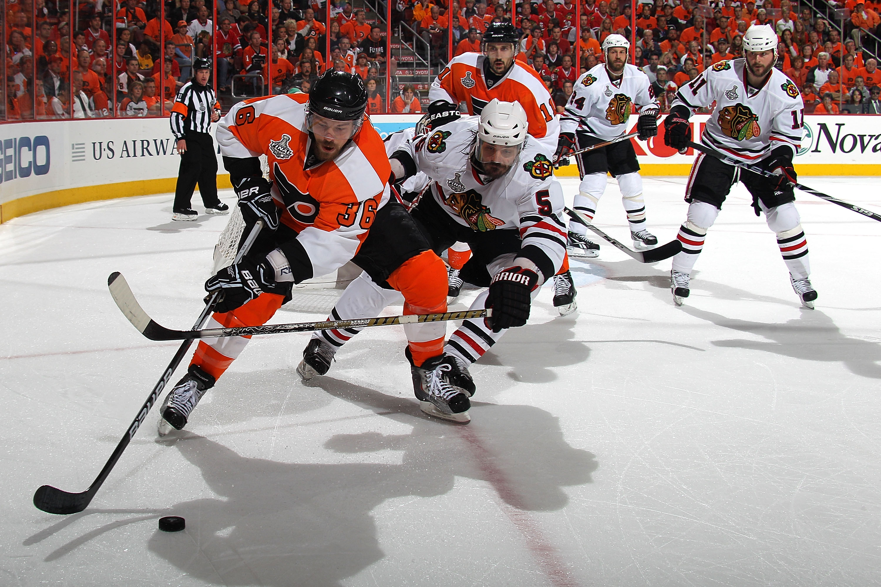 PHILADELPHIA - JUNE 09:  Darroll Powe #36 of the Philadelphia Flyers handles the puck against Brent Sopel #5 of the Chicago Blackhawks in Game Six of the 2010 NHL Stanley Cup Final at the Wachovia Center on June 9, 2010 in Philadelphia, Pennsylvania.  (Photo by Bruce Bennett/Getty Images)