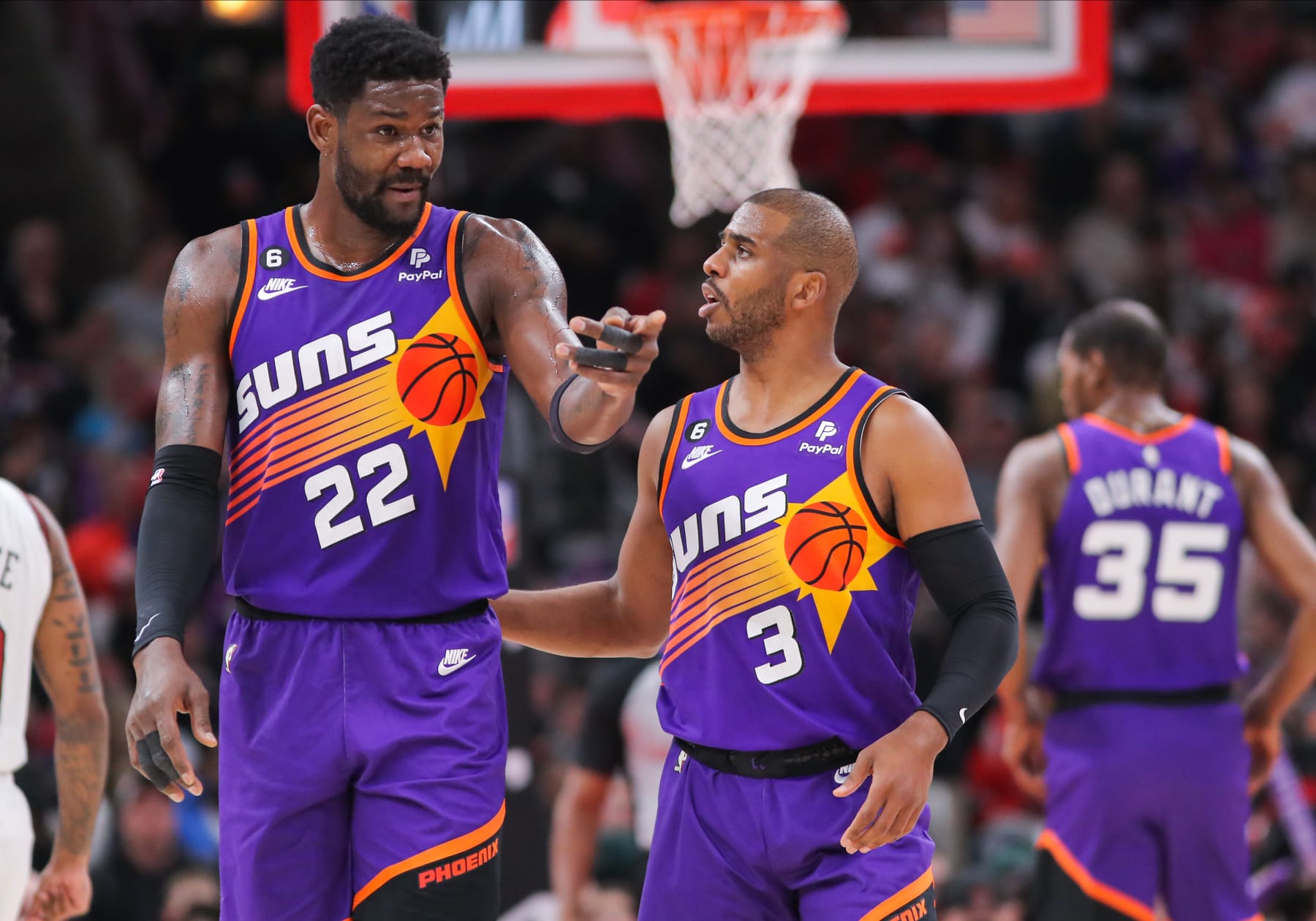 CHICAGO, IL - MARCH 03: Phoenix Suns Center DeAndre Ayton (22) and Phoenix Suns Guard Chris Paul (3) chat during a NBA game between the Phoenix Suns  and the Chicago Bulls on March 3, 2023 at the United Center in Chicago, IL. (Photo by Melissa Tamez/Icon Sportswire via Getty Images)