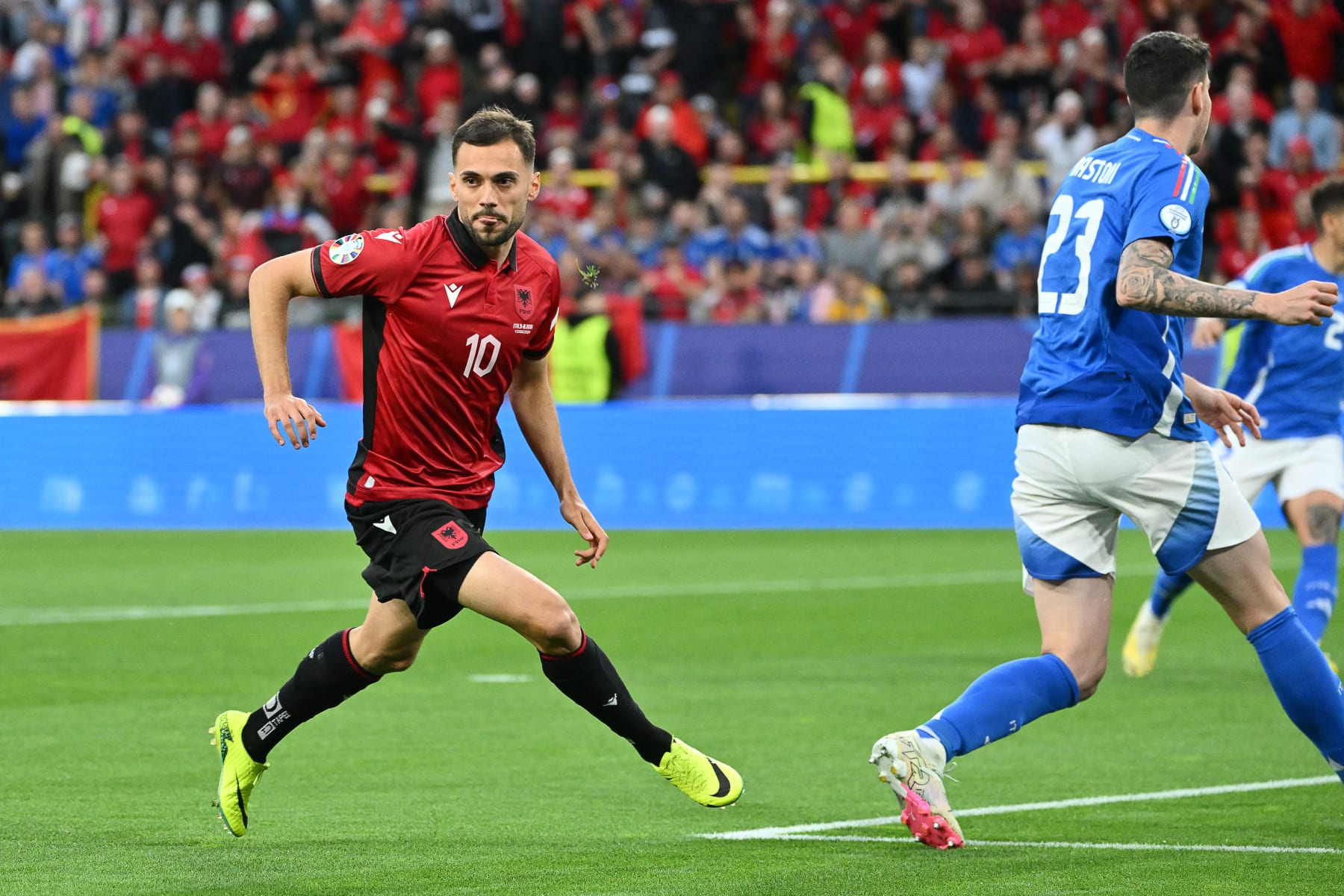 Albania's midfielder #10 Nedim Bajrami celebrates scoring his team's first goal during the UEFA Euro 2024 Group B football match between Italy and Albania at the BVB Stadion in Dortmund on June 15, 2024. (Photo by Alberto PIZZOLI / AFP) (Photo by ALBERTO PIZZOLI/AFP via Getty Images)