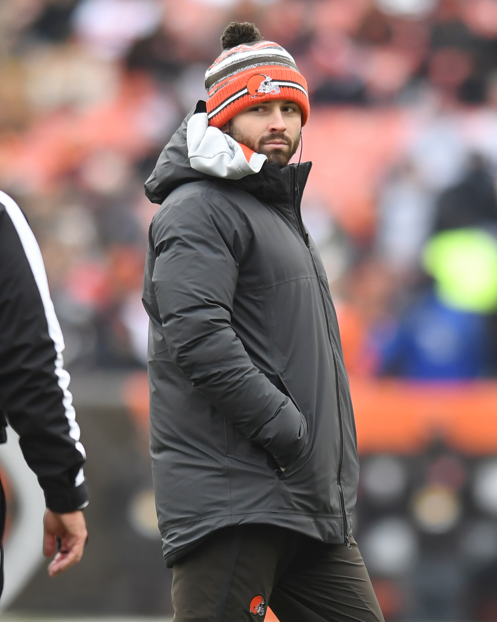Cleveland Browns quarterback Baker Mayfield walks on the field during a timeout during the first half of an NFL football game against the Cincinnati Bengals, Sunday, Jan. 9, 2022, in Cleveland. (AP Photo/Nick Cammett)