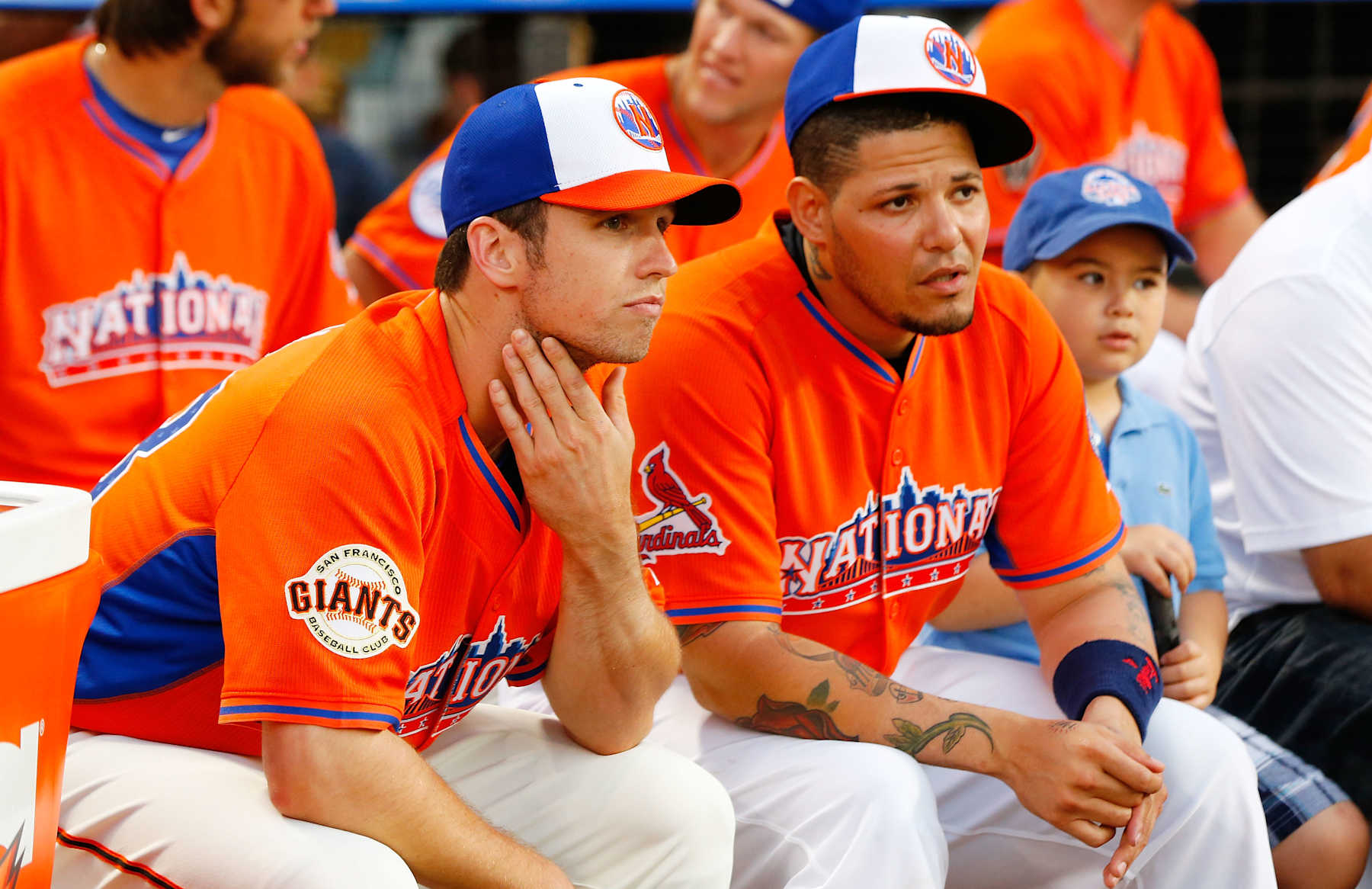 NEW YORK, NY - JULY 15:  Buster Posey of the San Francisco Giants and Yadier Molina of ths St. Louis Cardinals look on during the Chevrolet Home Run Derby on July 15, 2013 at Citi Field in the Flushing neighborhood of the Queens borough of New York City.  (Photo by Jim McIsaac/Getty Images) 