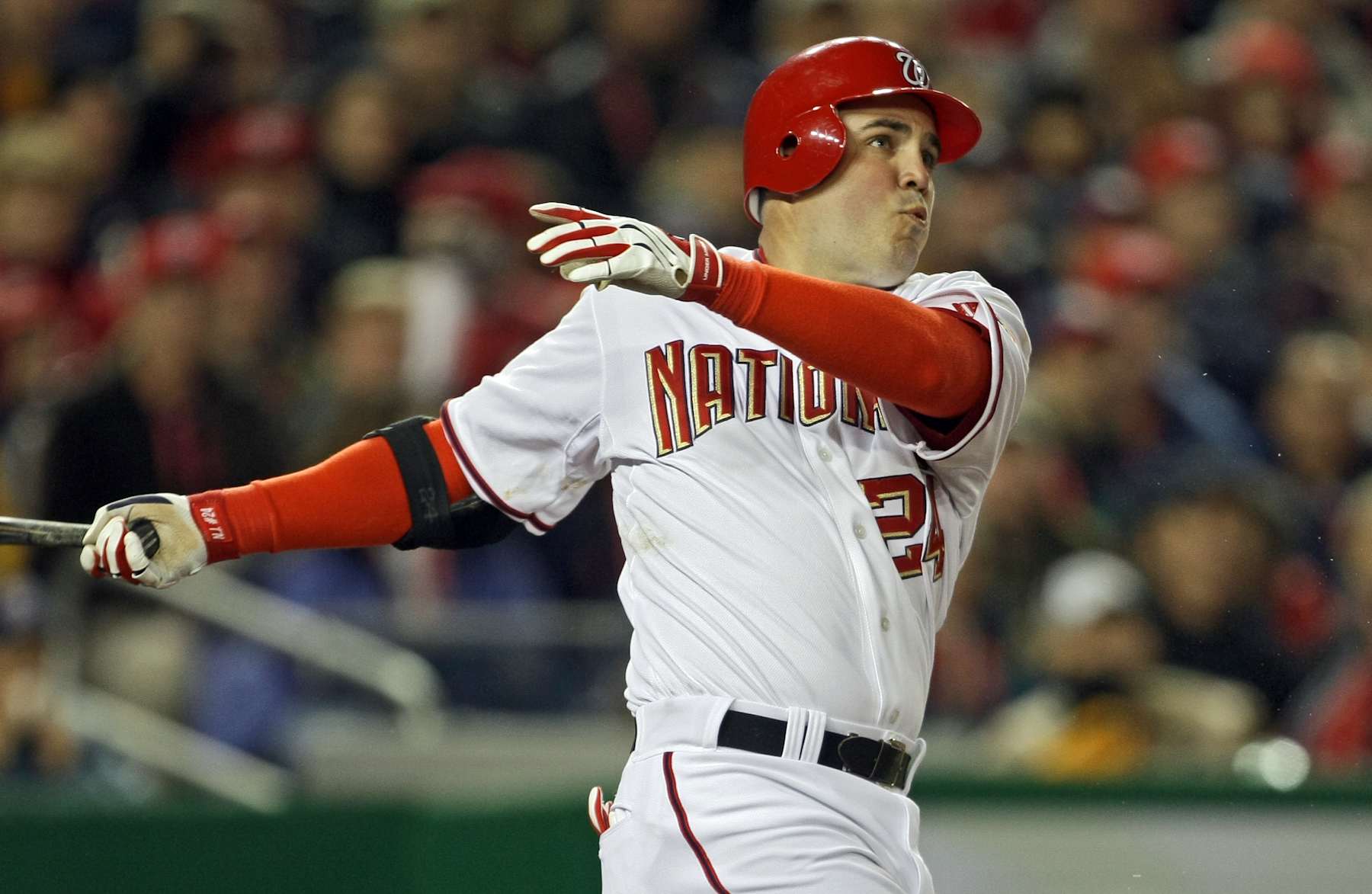 WASHINGTON - MARCH 30:  Nick Johnson #24  of the Washington Nationals hits a RBI double in the first inning during the game against the Atlanta Braves on opening day March 30, 2008 at Nationals Park in Washington, DC.  (Photo by Drew Hallowell/Getty Images)
