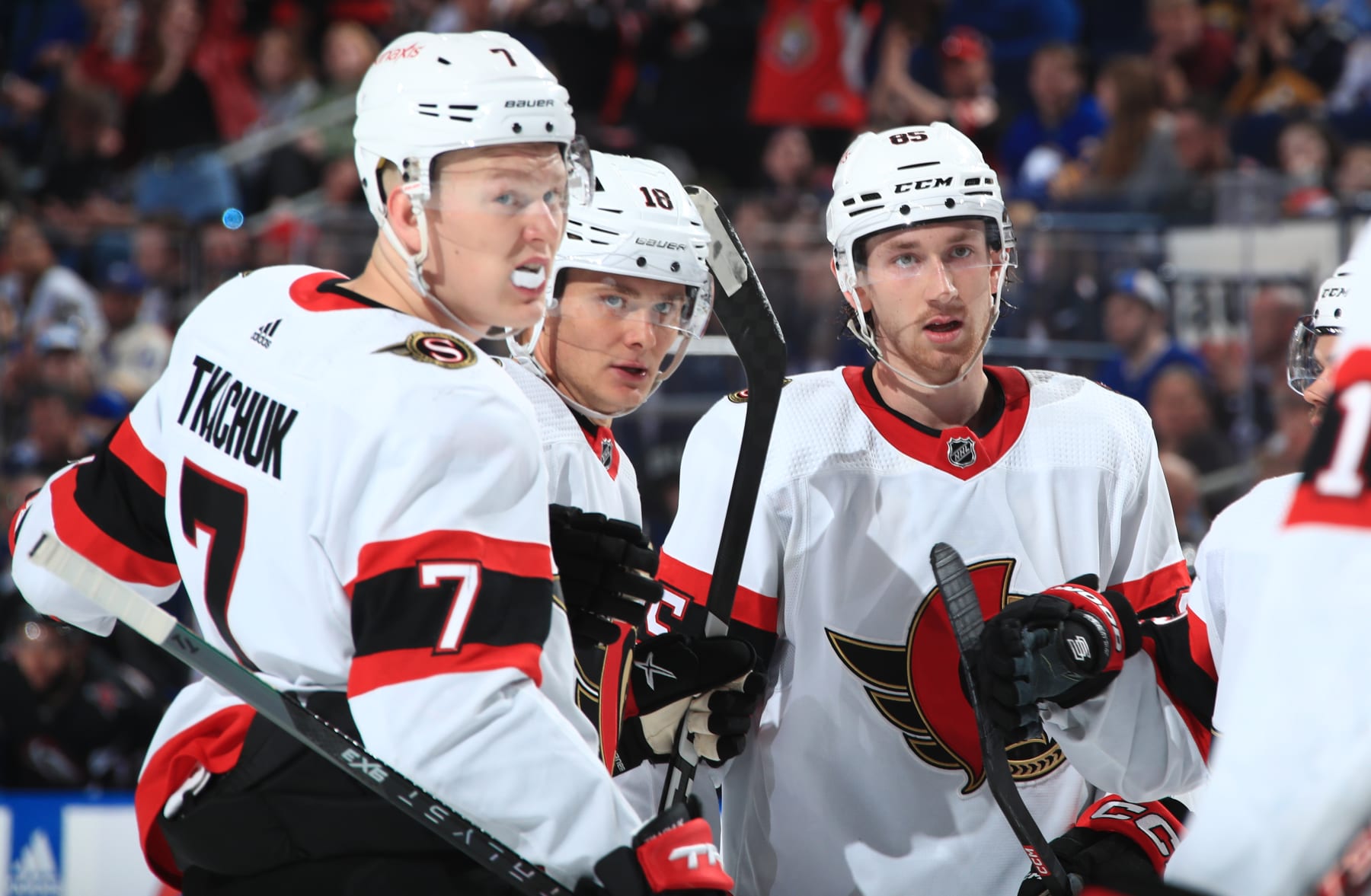 BUFFALO, NY - APRIL 13: Tim Stützle #18 of the Ottawa Senators celebrates his second period goal with Brady Tkachuk #7 and Jake Sanderson #85 during an NHL game against the Buffalo Sabres  on April 13, 2023 at KeyBank Center in Buffalo, New York. (Photo by Bill Wippert/NHLI via Getty Images)