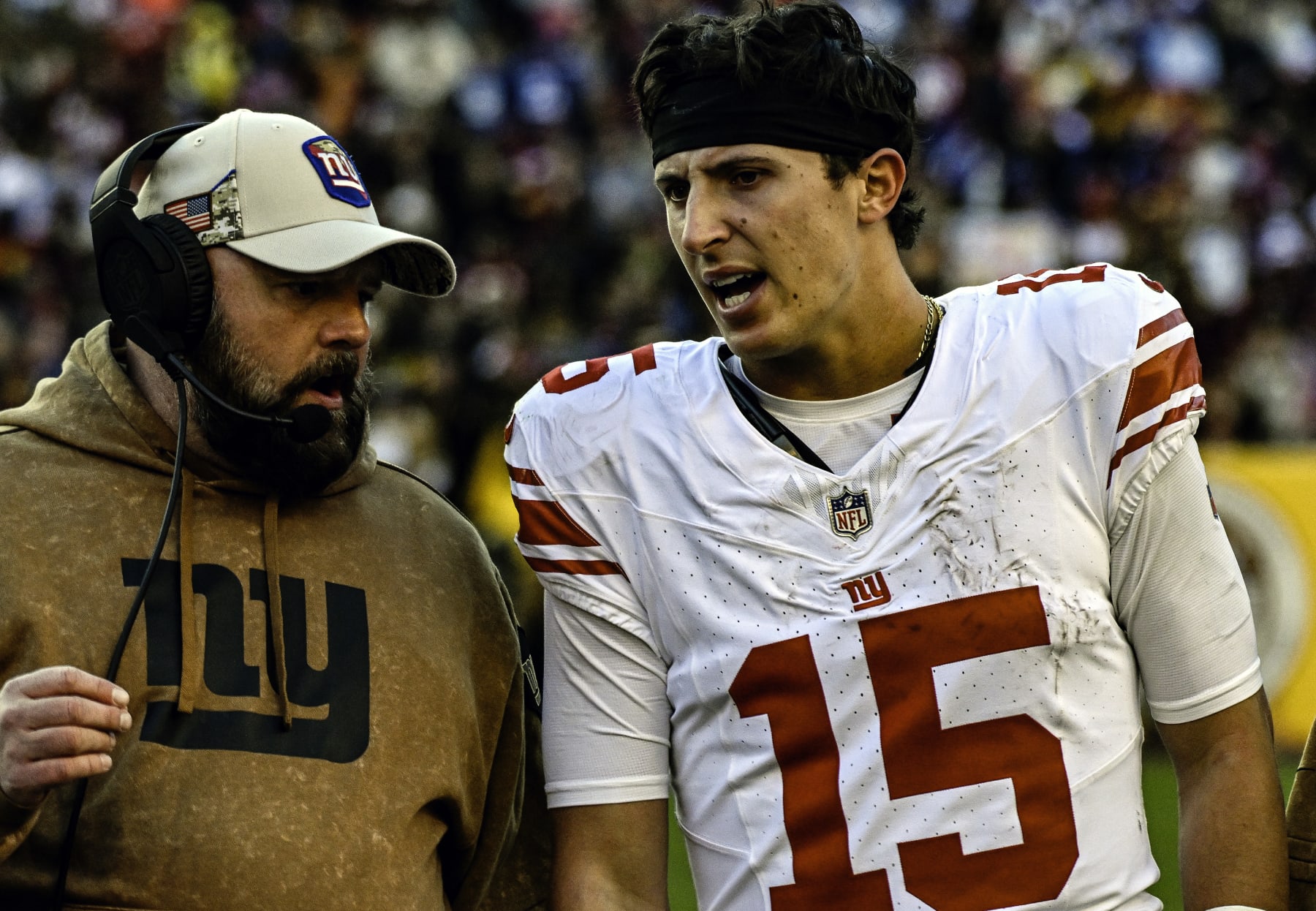LANDOVER, MD - NOVEMBER 19: New York Giants quarterback Tommy DeVito (15) talks with head coach Brian Daboll (L) on the sidelines during the NFL game between the New York Giants and the Washington Commanders on November 19, 2023 at Fed Ex Field in Landover, MD. (Photo by Mark Goldman/Icon Sportswire via Getty Images)