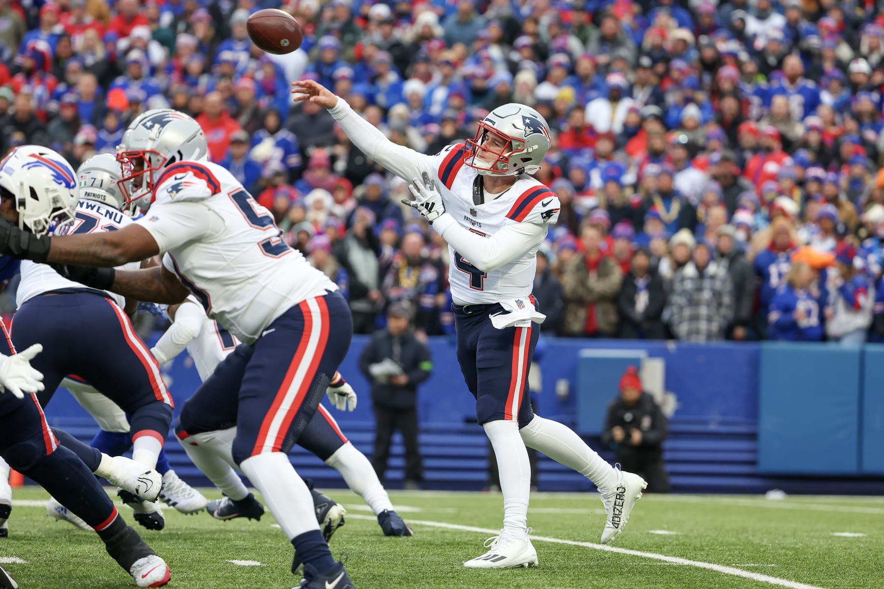 ORCHARD PARK, NEW YORK - DECEMBER 31: Bailey Zappe #4 of the New England Patriots throws a pass during the first half of a game against the Buffalo Bills at Highmark Stadium on December 31, 2023 in Orchard Park, New York. (Photo by Timothy T Ludwig/Getty Images)