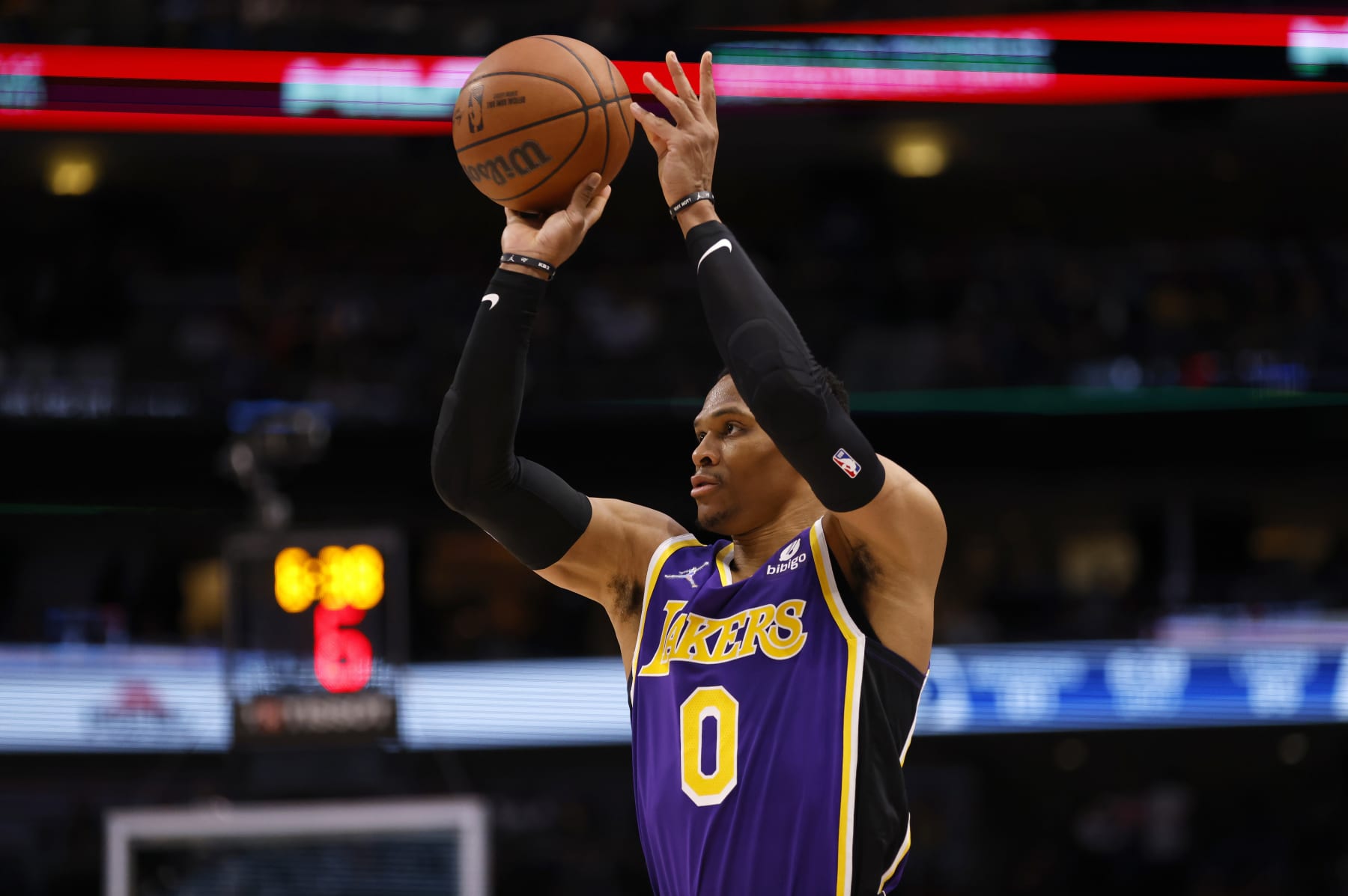 DALLAS, TX - MARCH 29: Russell Westbrook #0 of the Los Angeles Lakers shoots the ball against the Dallas Mavericks in the second half at American Airlines Center on March 29, 2022 in Dallas, Texas. The Mavericks won 128-110. NOTE TO USER: User expressly acknowledges and agrees that, by downloading and or using this photograph, User is consenting to the terms and conditions of the Getty Images License Agreement. (Photo by Ron Jenkins/Getty Images)