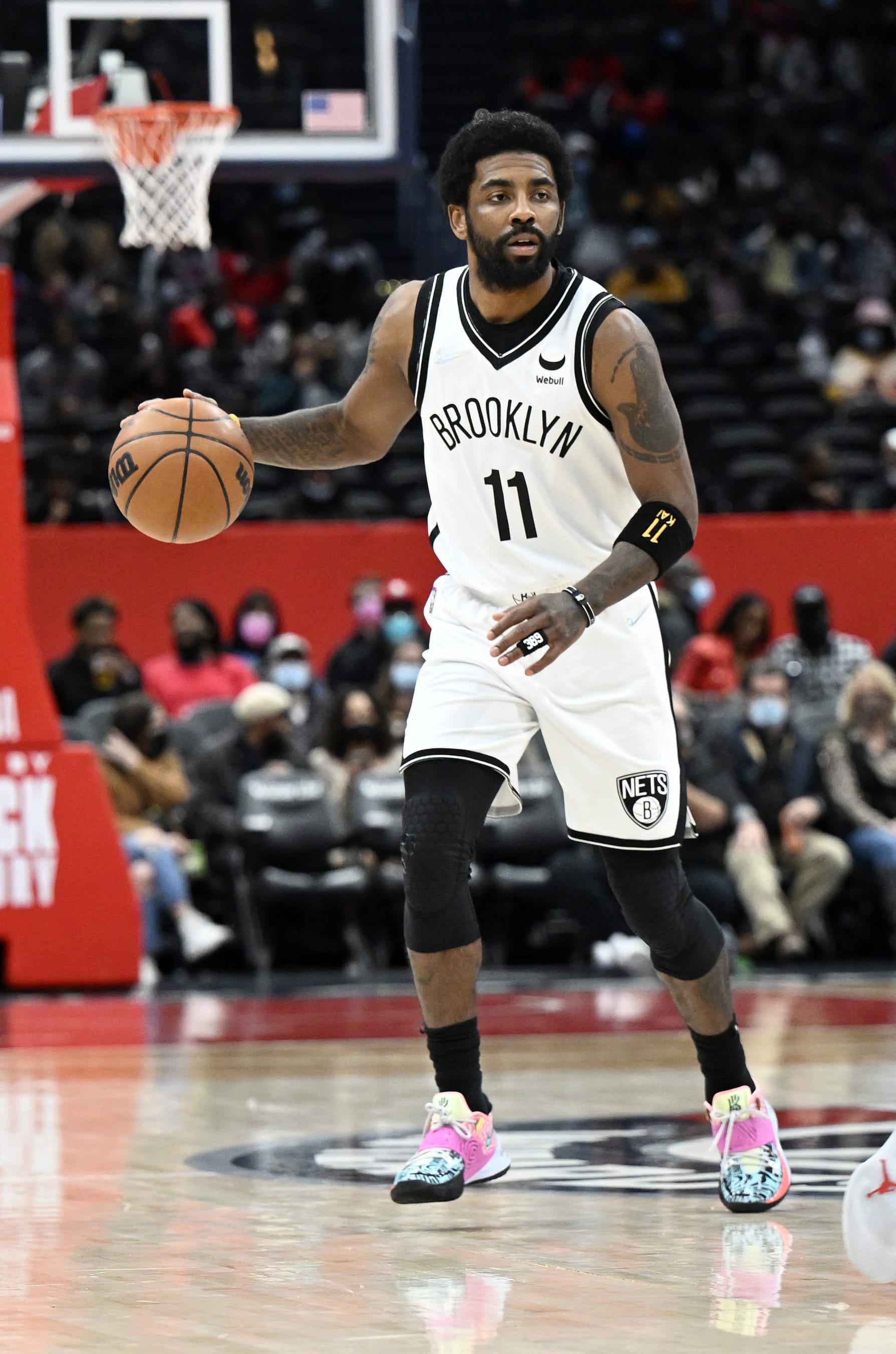 WASHINGTON, DC - FEBRUARY 10: Kyrie Irving #11 of the Brooklyn Nets handles the ball against the Washington Wizards at Capital One Arena on February 10, 2022 in Washington, DC. NOTE TO USER: User expressly acknowledges and agrees that, by downloading and or using this photograph, User is consenting to the terms and conditions of the Getty Images License Agreement.  (Photo by G Fiume/Getty Images)